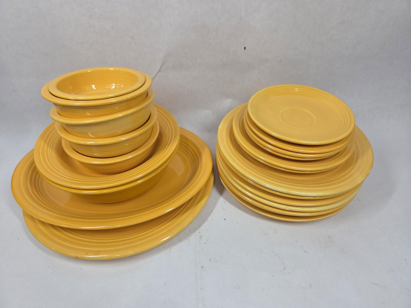 Golden Yellow Fiesta Serving Plates, Bowls, and Platters: 21 pieces, all in good condition