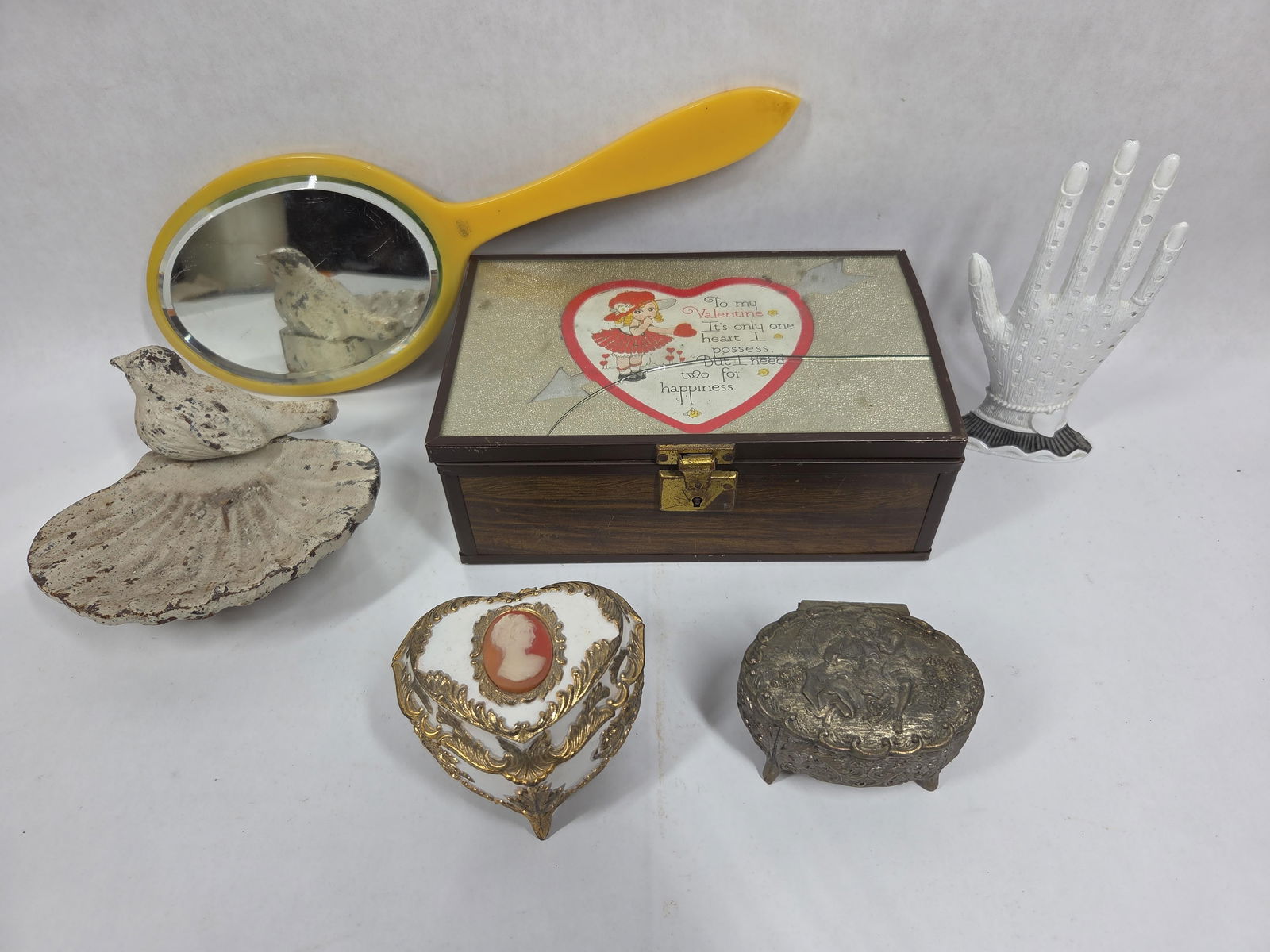 Assorted Jewelry Holder, Trinkets, Dresser Chest and Vanity Mirror Lot: This great assorted lot includes an earring holder, 2 trinket boxes, a bird and shell cast iron jewelry dish, vanity mirror and dresser chest box