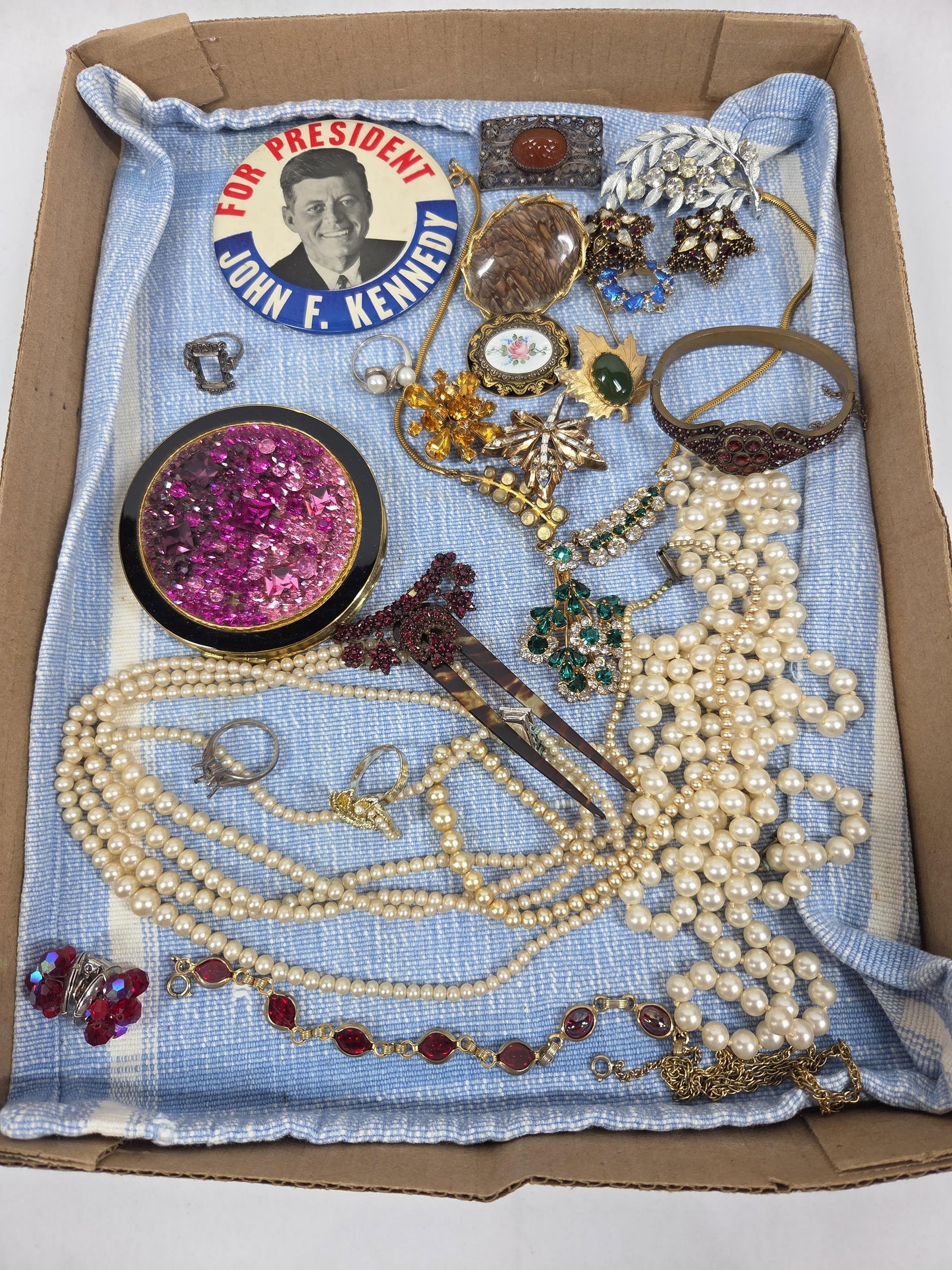 JFK Pin, Pearls, Hair Comb, and more: Stone jewelry, gem covered compact, brooches, and great jewelry pieces. Button showing JFK for president. Several sterling rings are included but do not have stones.