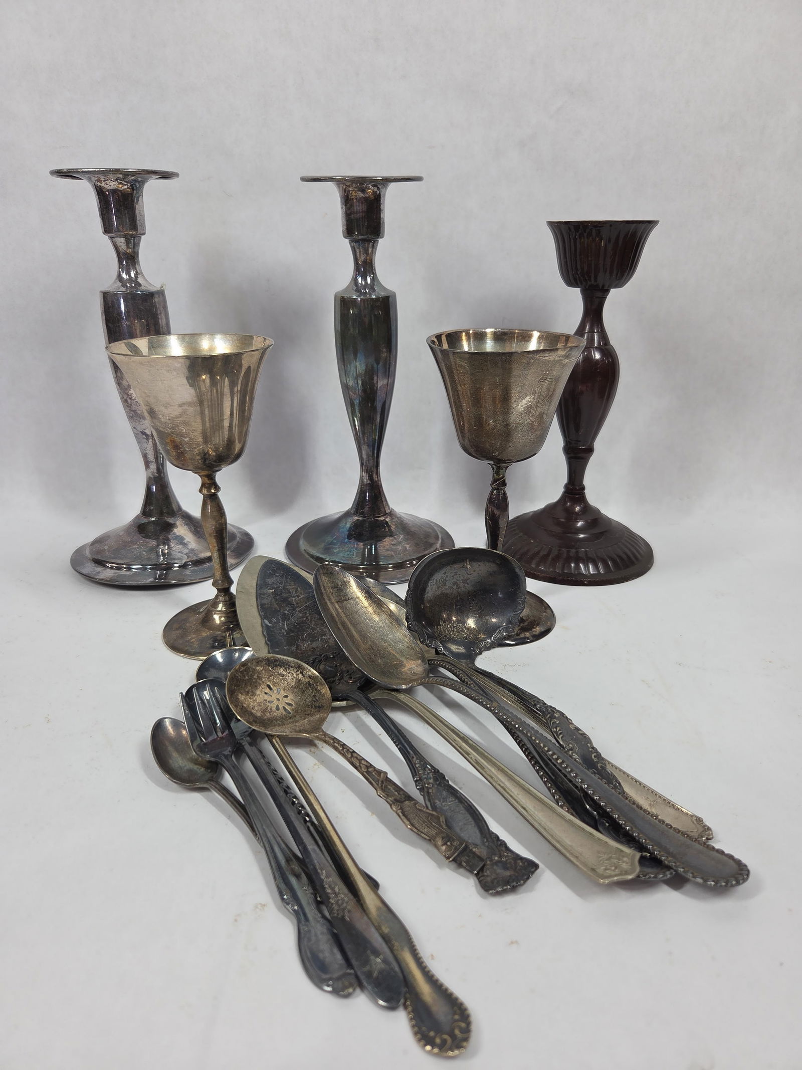 Silver Plated Utensils and Candle Sticks: Several different patterns. Featuring brands from early 19th century. Rogers & Bros and more