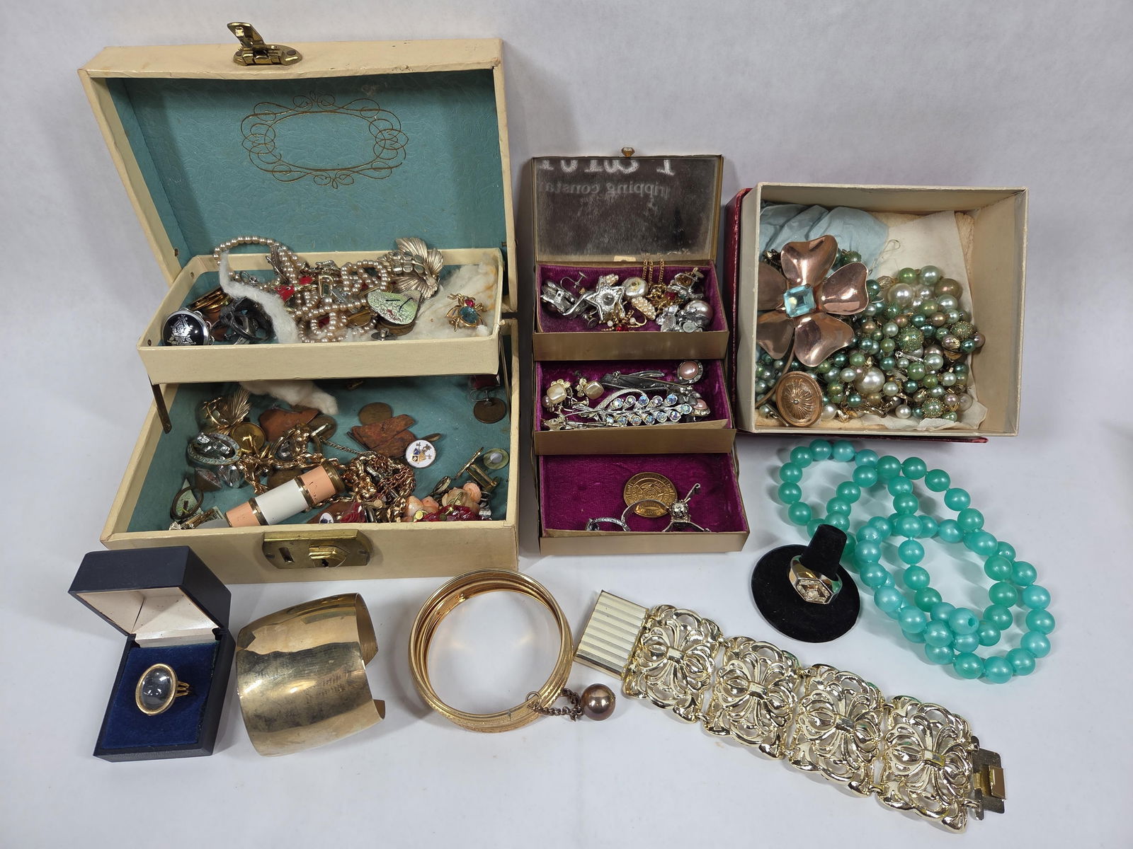 Coro Insect Pin, Coins, Brooches, and Jewelry: A nice selection of early jewelry including several name brand pieces. A ring is included marked 14K gold but we are unsure if it is real. Several wheat pennies, and other rings.