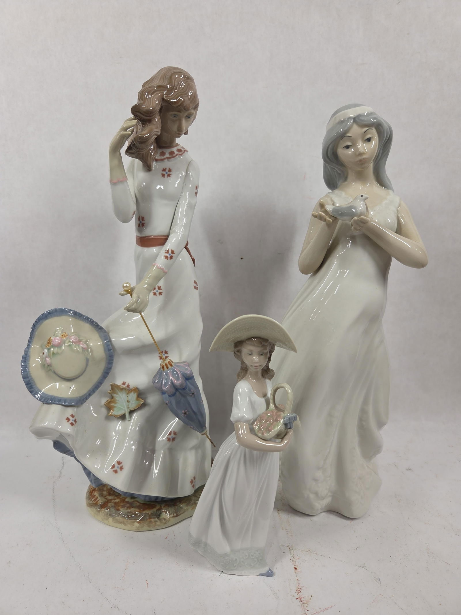 Lladro Porcelain Figural Lot of 3 Inc. NAO Spring Flowers, Afternoon Prominade and Autumn Windswept (1 of 7)