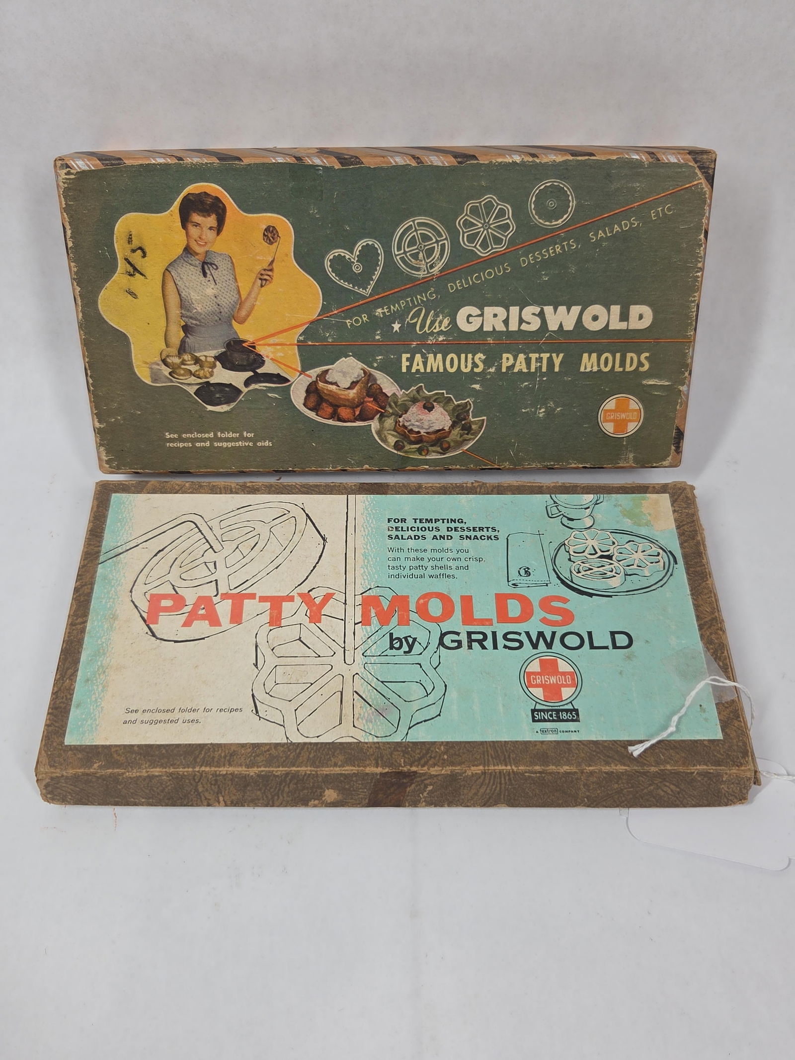 Grisowld NOS Cast Iron Patty Molds: Great lot of 2 sets of patty molds being in original packaging and appear to be NOS unused like new