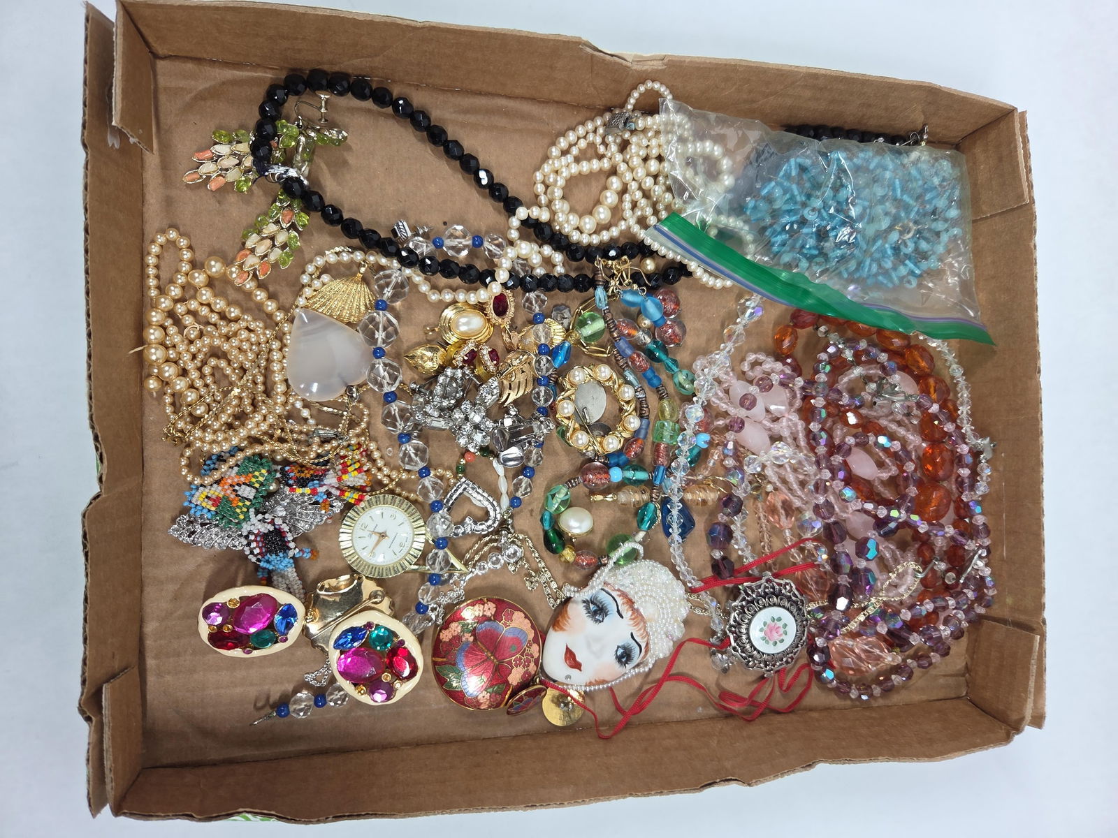 Enameled Brooch, Beaded, Ruby Set and Jewelry: A nice variety of jewelry including a few earring and pendant sets. Some earrings may not have matches.