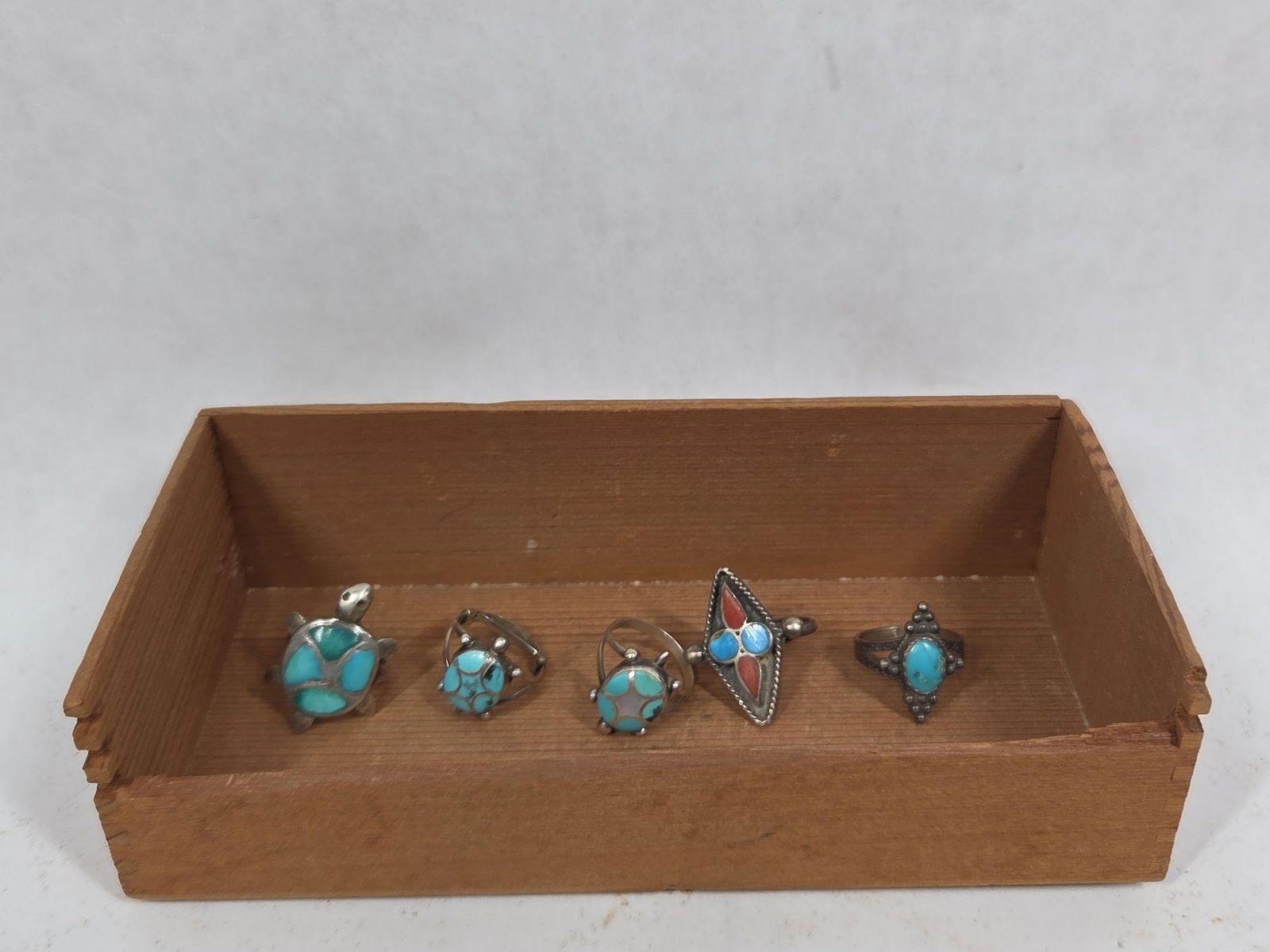 Sterling Silver & Turquoise Rings: Several turtle shaped rings and coral decorated. Approx size 6 to 8