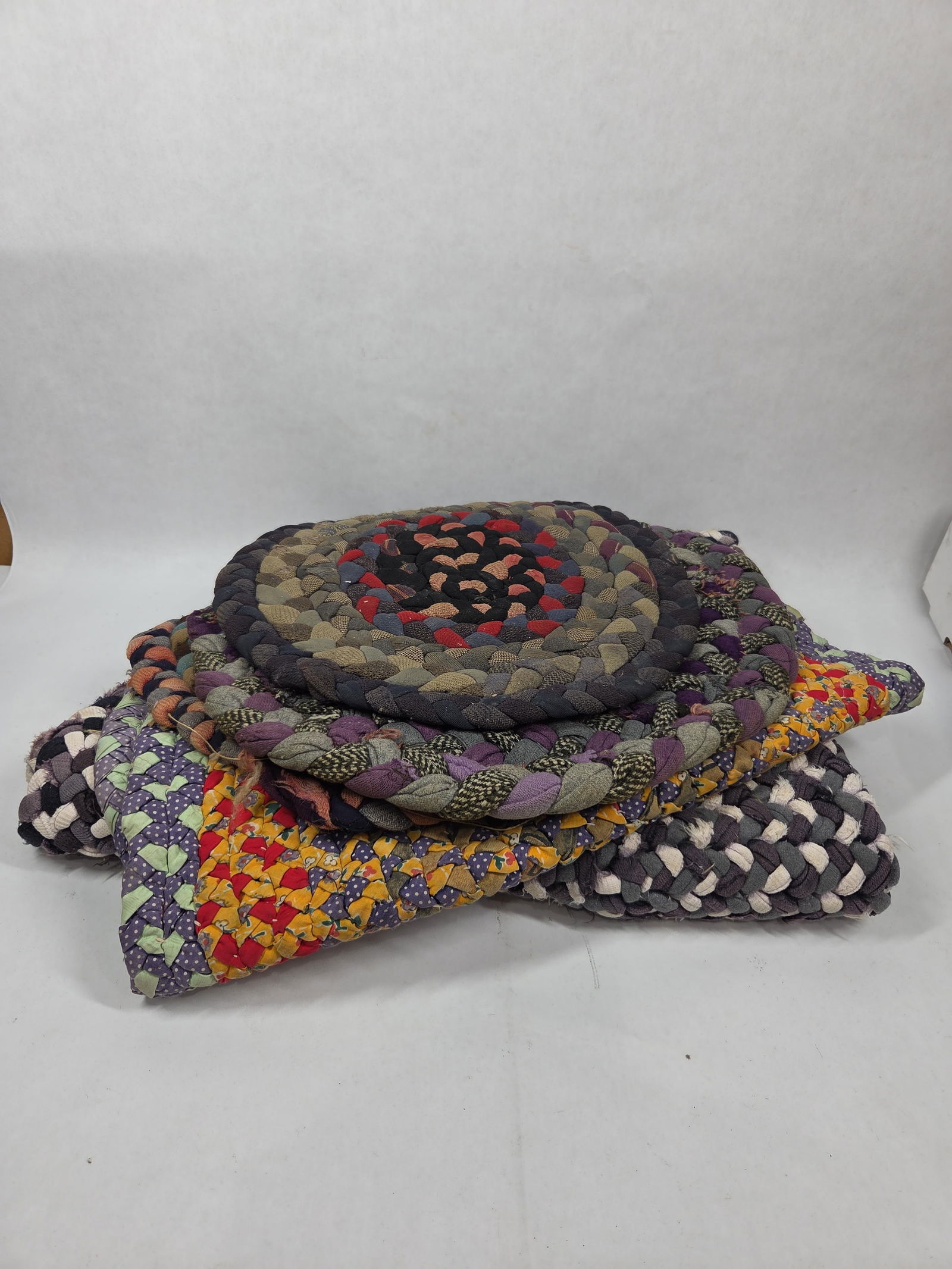 Great Primitive Hand Crafted Braided Rag Rugs: This great early lot of multi textile rugs incl. 5 various sized and shapes rugs as seen in photos