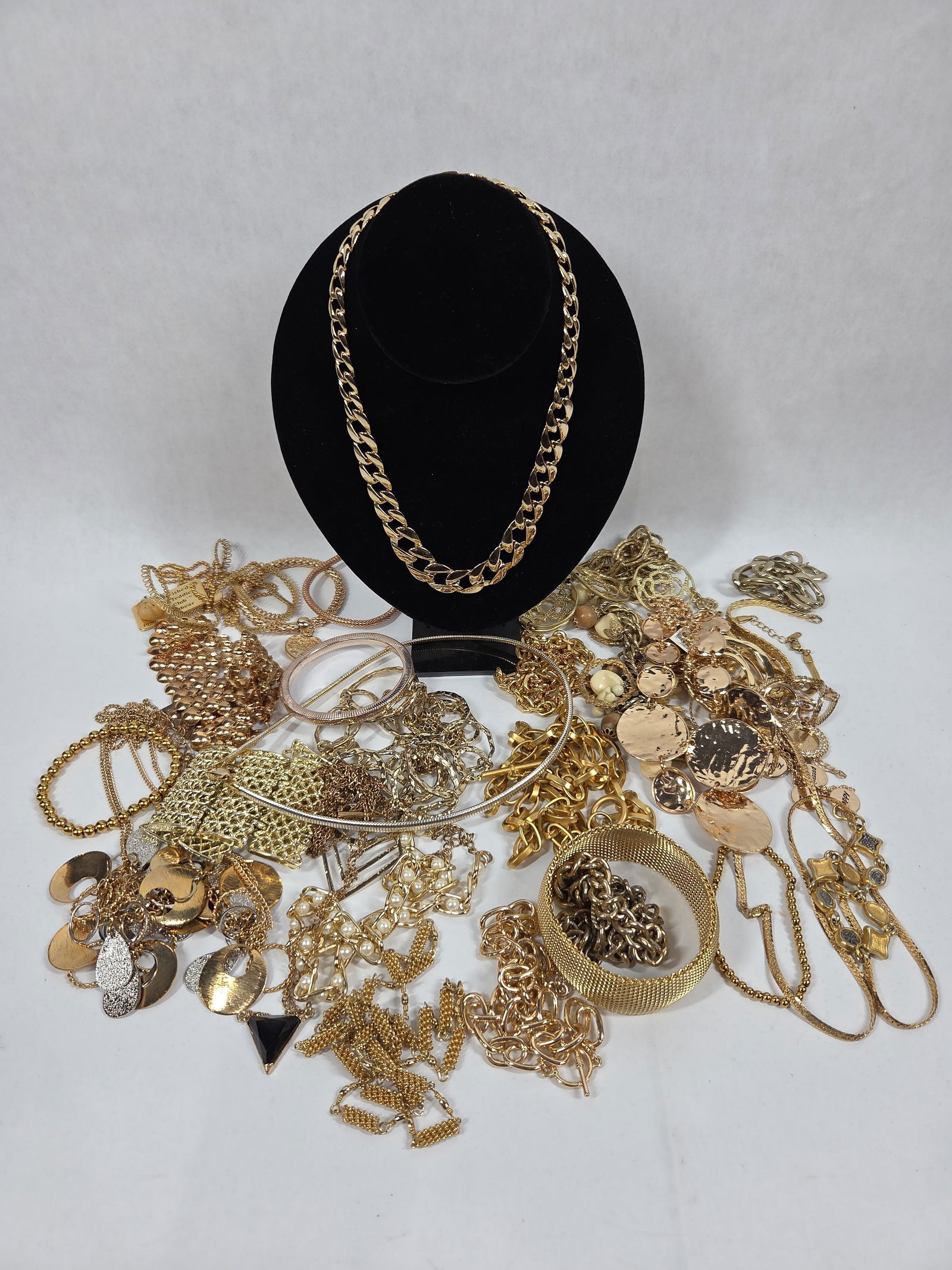 Gold Tone Necklaces, and Jewelry: A good variety of necklaces, bracelets, and chains.