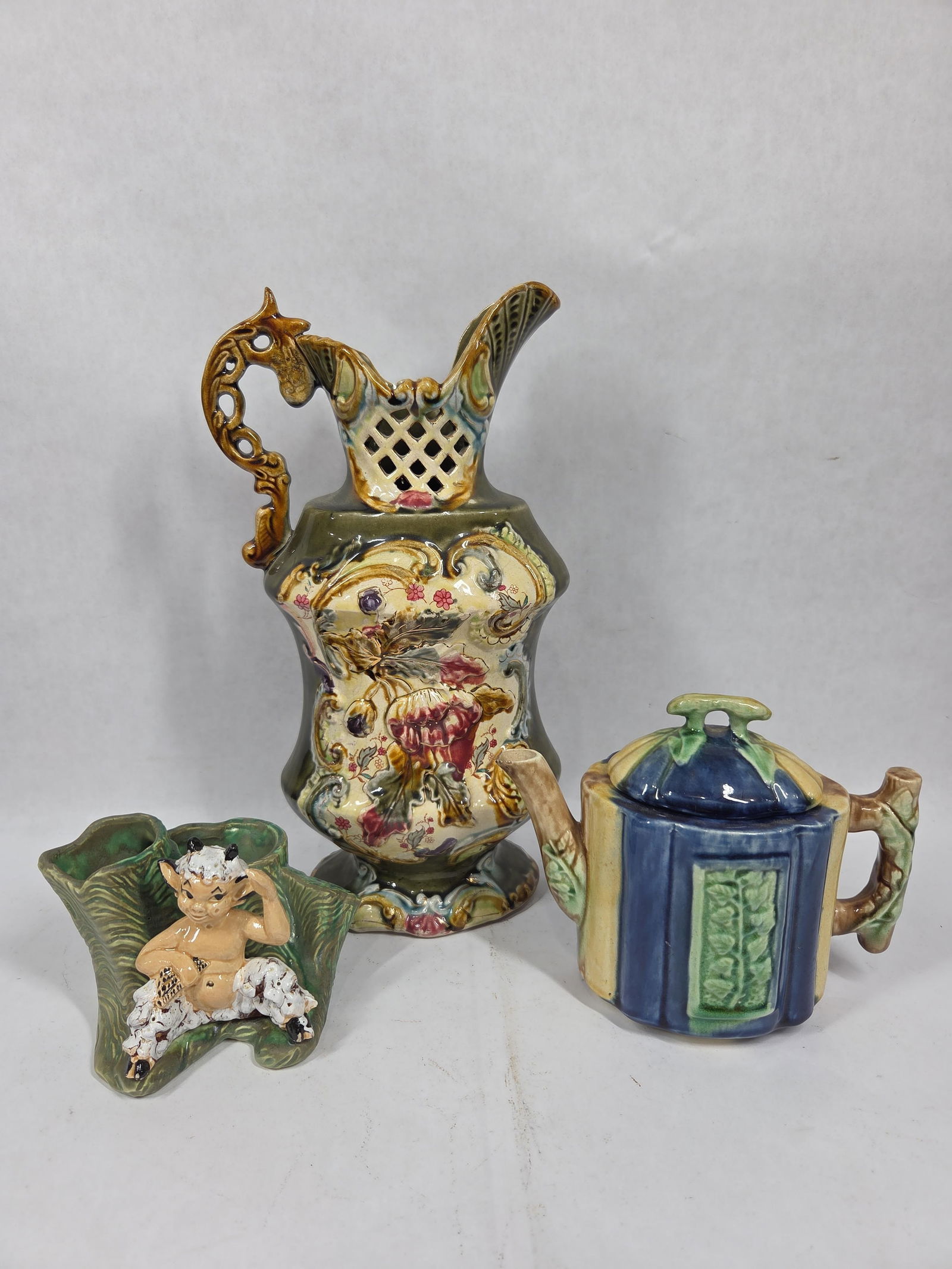 European Majolica Pitcher, Majolica Bamboo Teapot and Bud Vase: This great hand painted lot is in overall great condition with pitcher measuring 13 in H? Teapot 6 x 8 and? bud vase 4 x 6