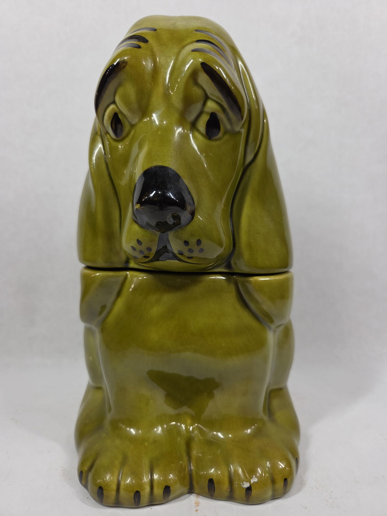 Ceramic Basset Hound 1960s Cookie Jar: Avocado green, approx 12 inches tall. A chip shows to inside of lid.