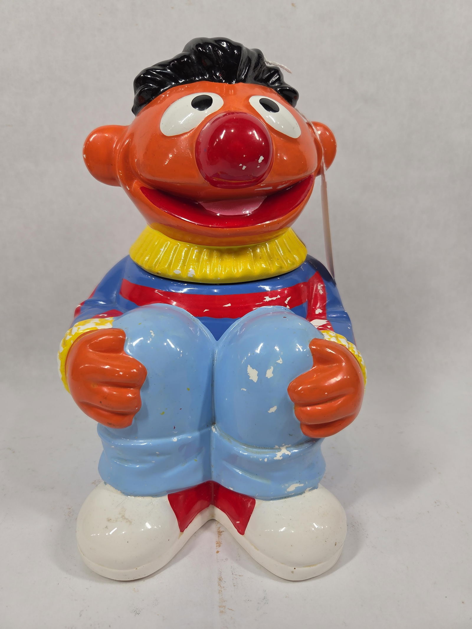 Muppets Inc Earnie Cookie Jar: Some paint loss shows throughout. No chips or cracks. 10 inches tall.