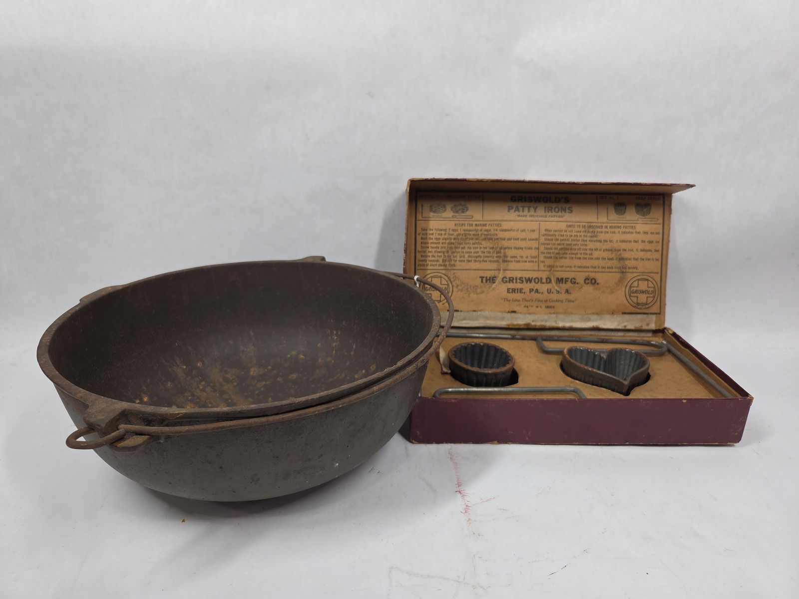 Griswold Cast Iron Bean Pot w/ Bale Handle and Heat Ring w/ Patty Iron Molds In Orig. Packaging: .