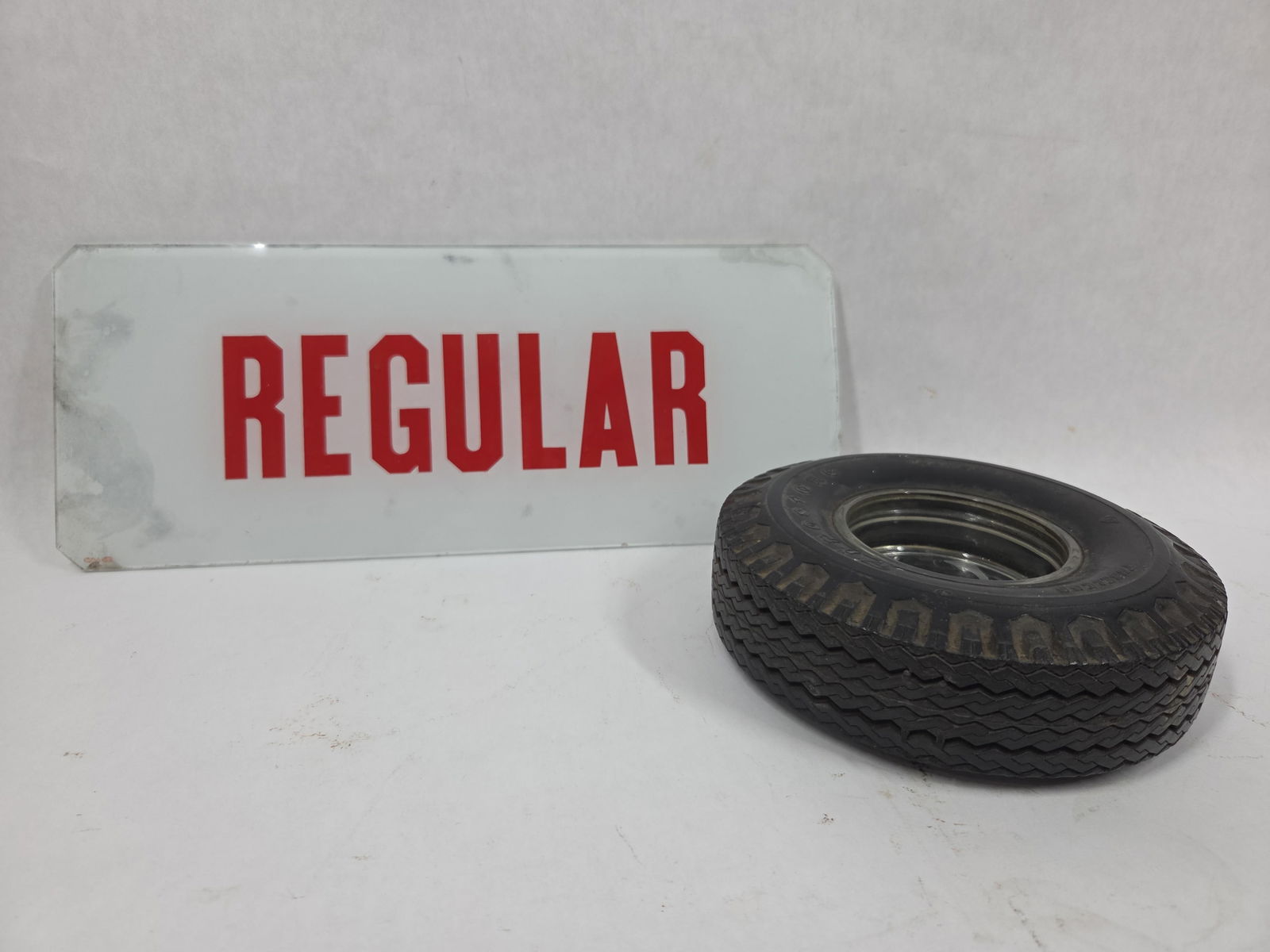 Reverse Painted REGULAR Glass Pump Plate and Firestone Collectible Tire Ash Tray: This great petro lot of 2 items are in good overall condition withcorners cutto reverse painted glass measuring 5 x 12.75 and ash tray measuring 6.5 in D overall