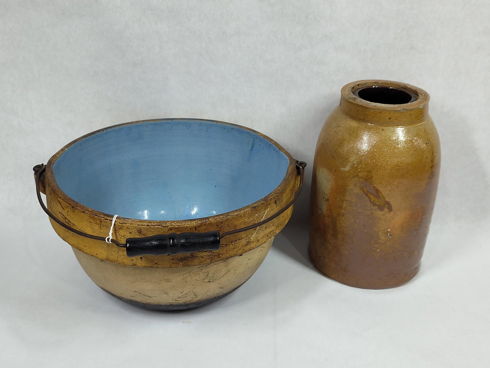 19th C. Salt Glazed Stoneware Canning Crock w/ German Stoneware Crock Bowl w/ Bale Handle: great overall condition showing minor flaking to areas with canning crock standing 8 in. H and German Stoneware Bowl being 9.5 in Diameter 
