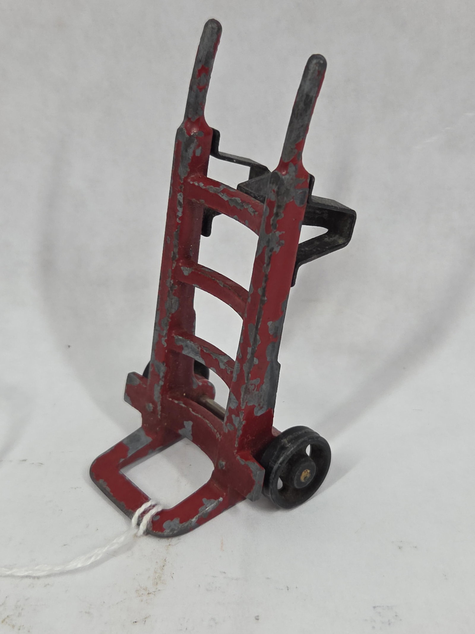 The Lionel Co. Miniature 2 Wheel Hand Truck / Dolly: Showing paint loss due to age and play? standing 3 in. H?