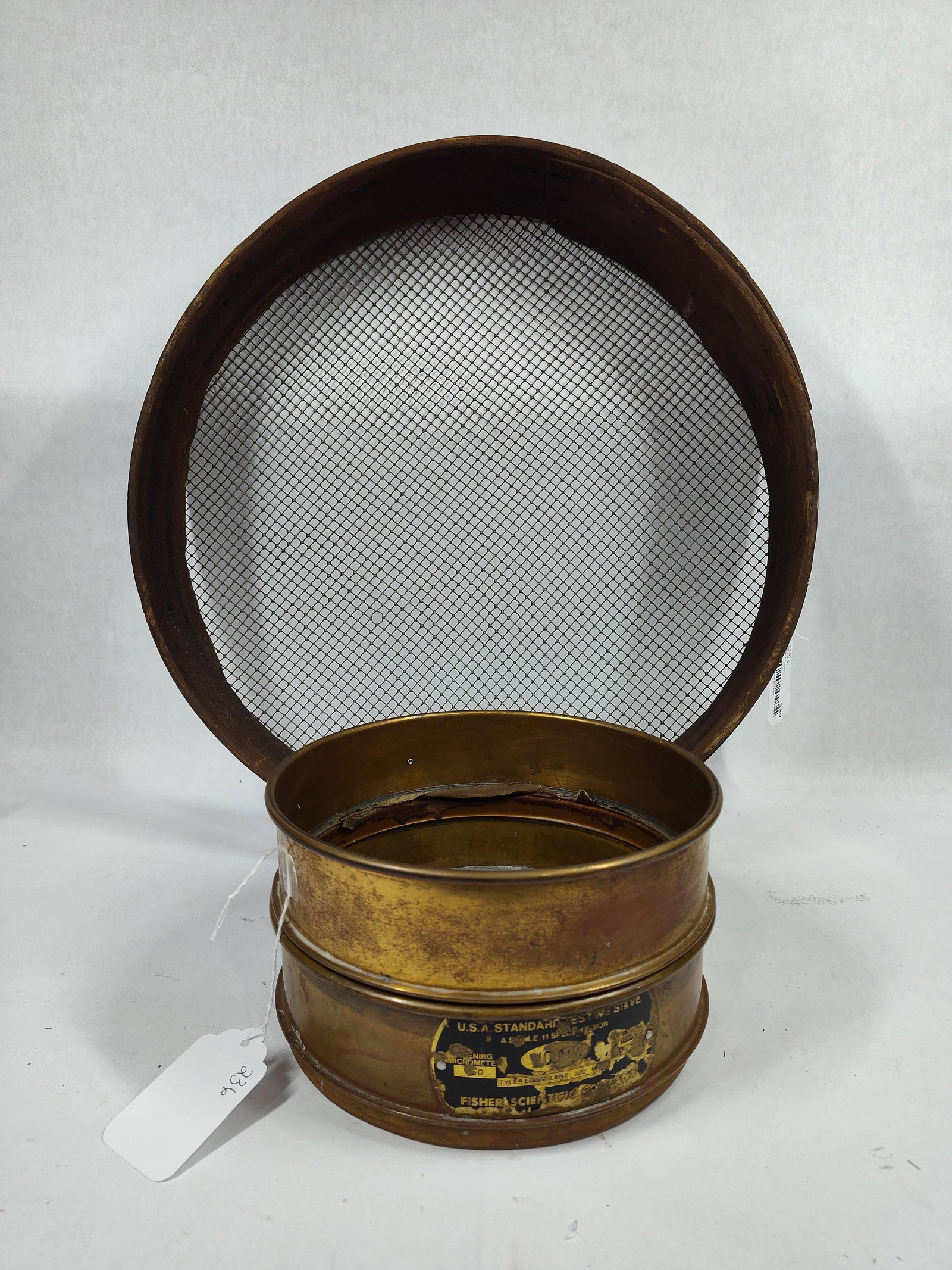 U.S.A. Standard Testing Brass Sieve No 200 & Primitive Wood Grain Sieve: Great early brass labeled and primitive sieve with brass measuring 8.5 in D and wood measuring 18 in Diameter 