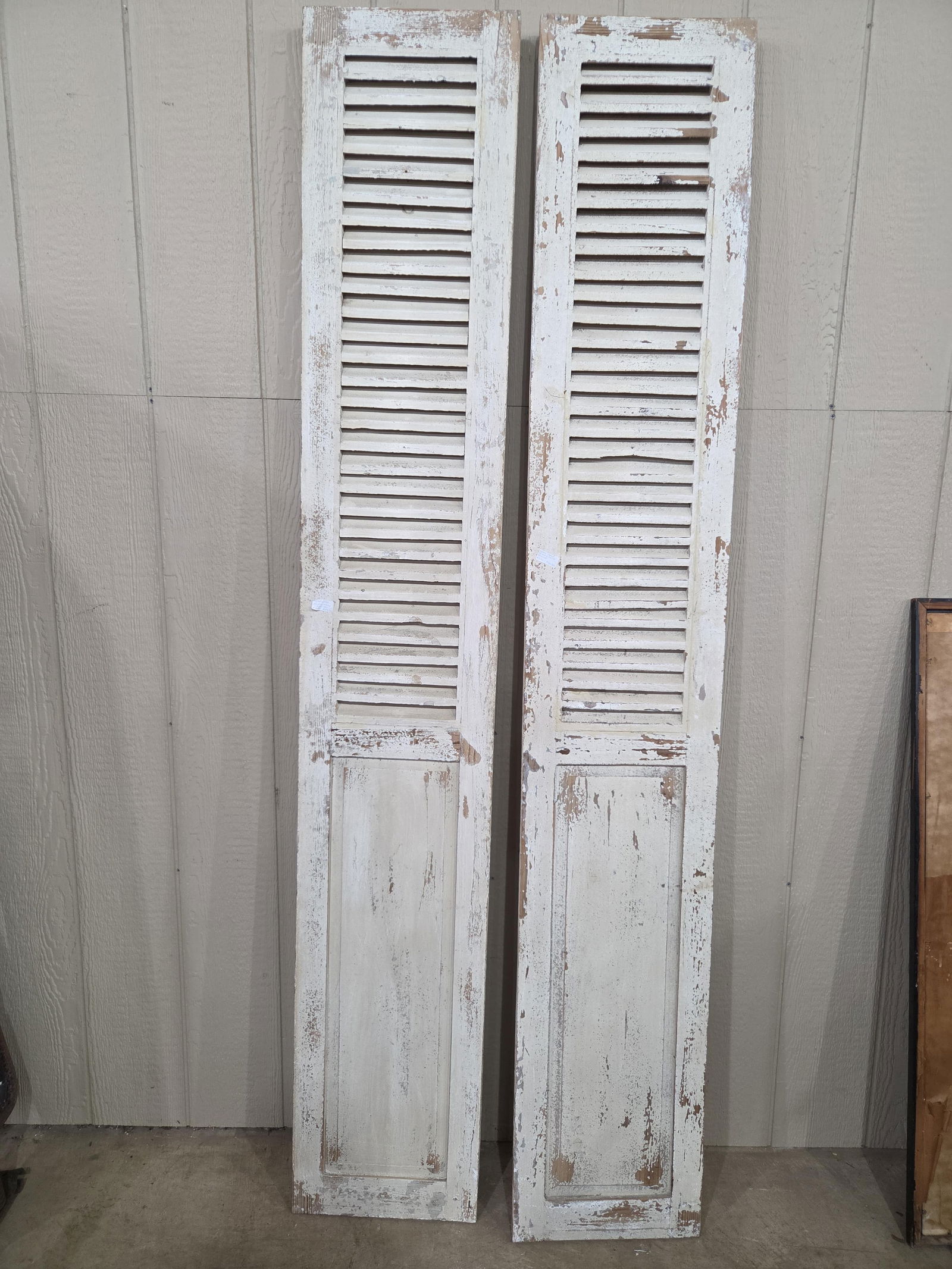 Farmhouse White Washed Shutters: Very good condition with louvers at the top and a solid panel towards the bottom. 82.5x13.5