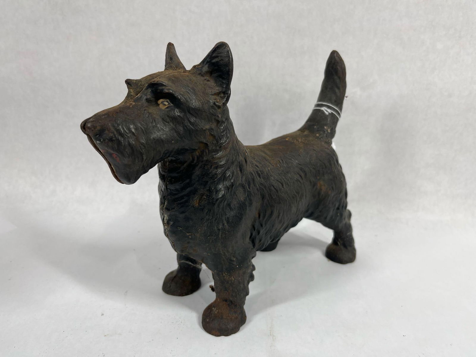 Scotty Dog Cast Iron Door Stop: A few areas of minor surface spotting. 10.5 inches long with painted eyes. 