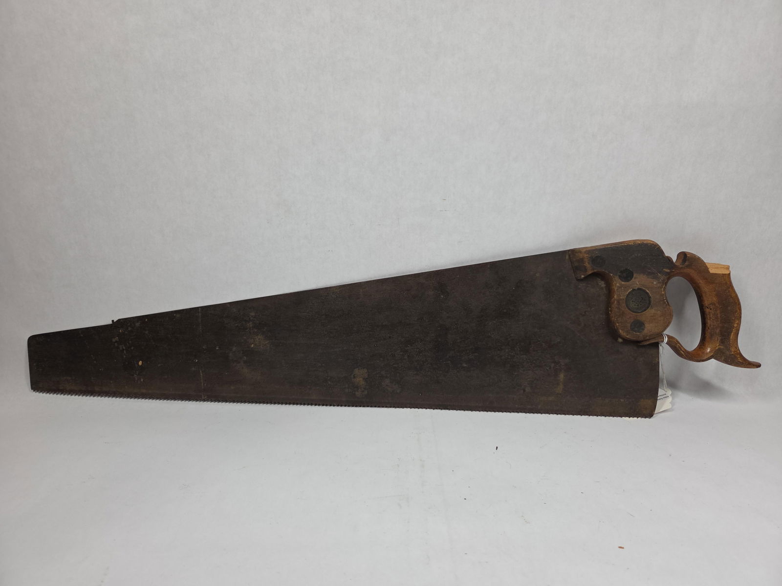 Spear & Jackson Saw: Sheffield England. 26 inch blade. Chip to handle.