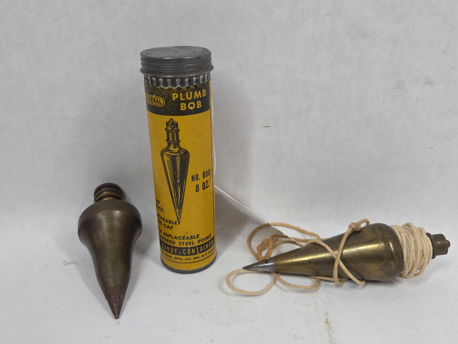 General and Other Plumb Bobs: All are brass. One in original packing.