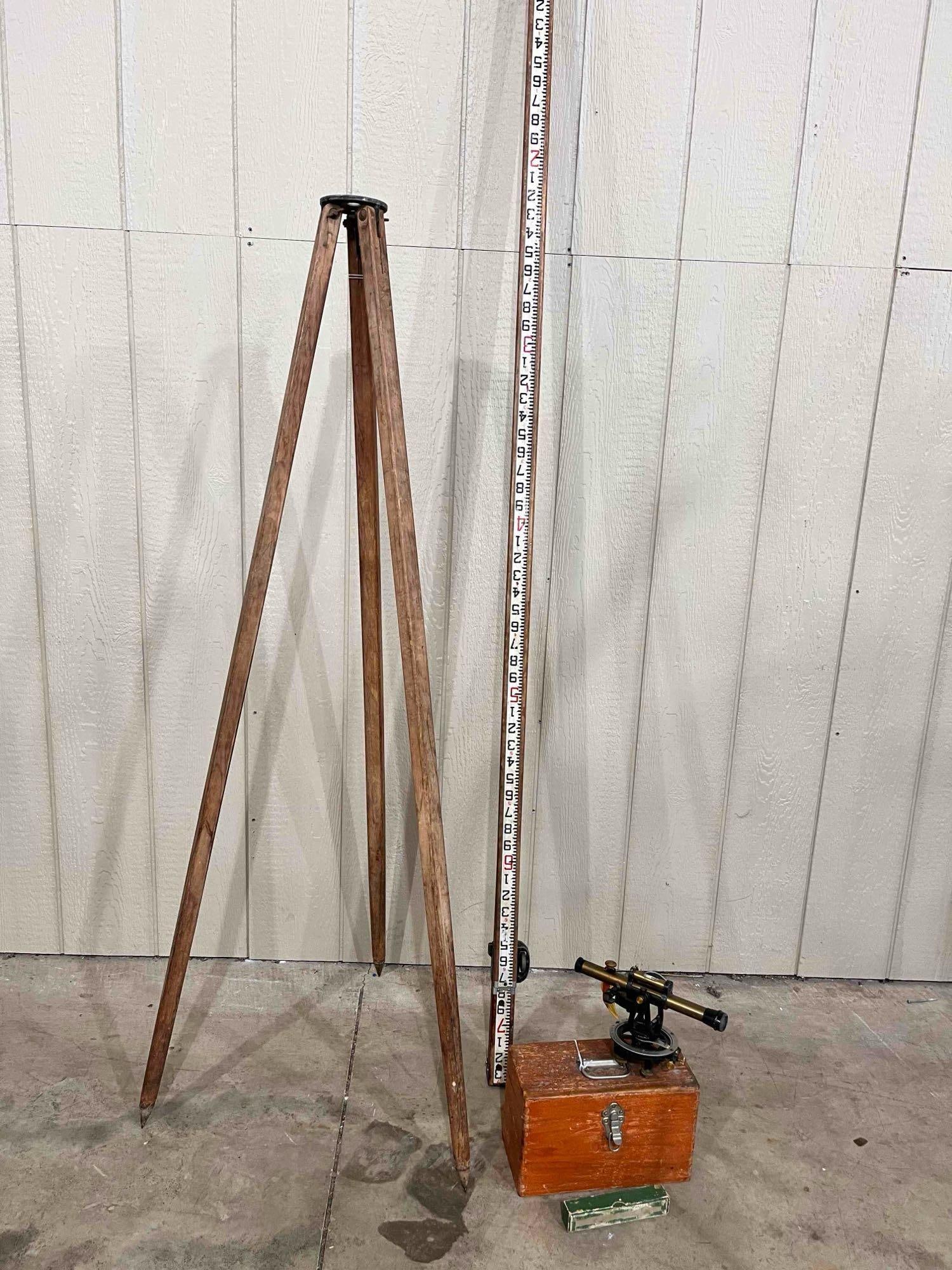 Complete Surveying Unit: Tripod, measuring stick, instrument and metal stakes. Brass unit with tag in dovetailed case.