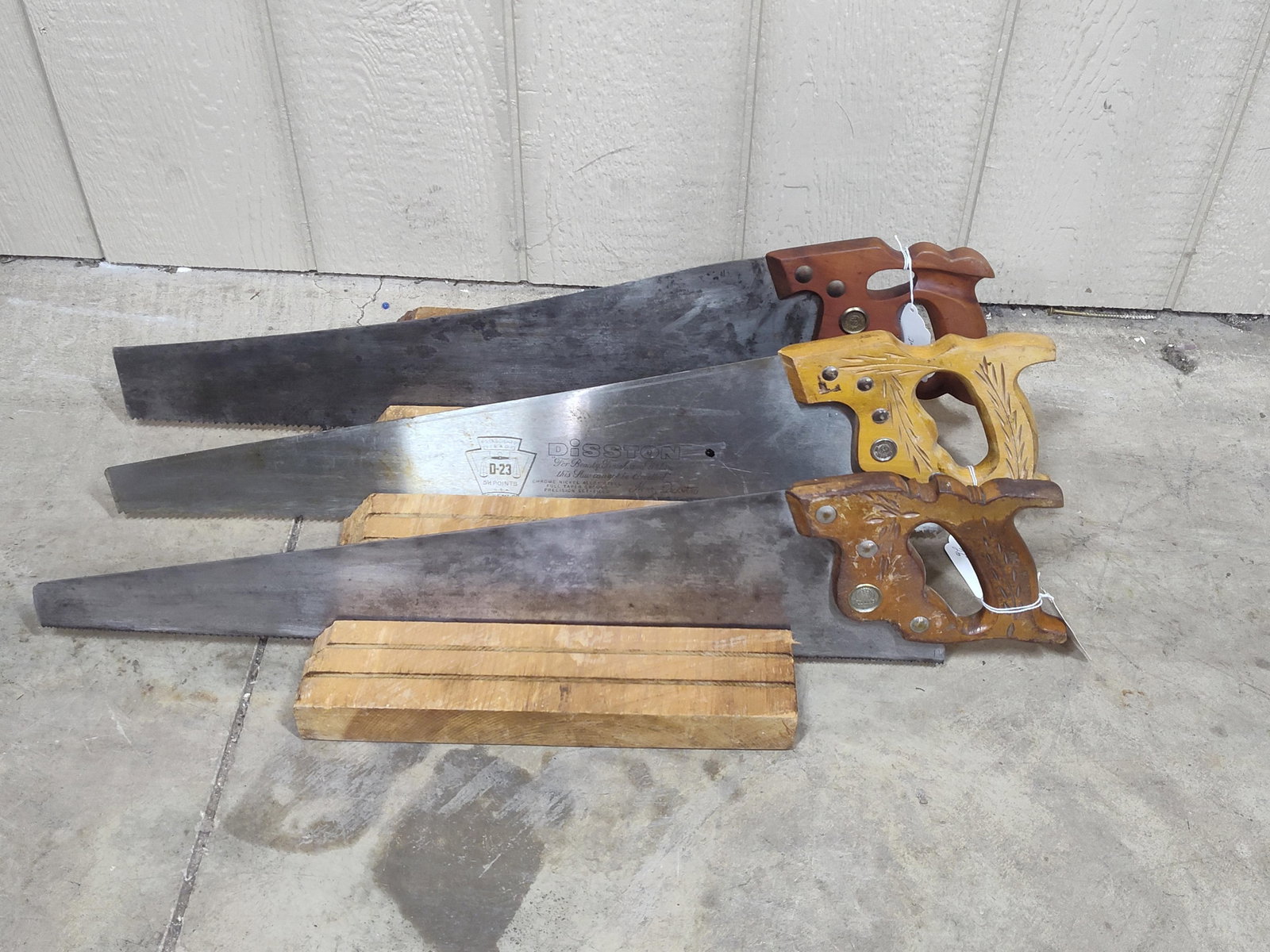 Rough Cut Saw Stand and Saws: Atkins 26 in, Disston D-23, and Disston 6 point rip. Stand is 14x17