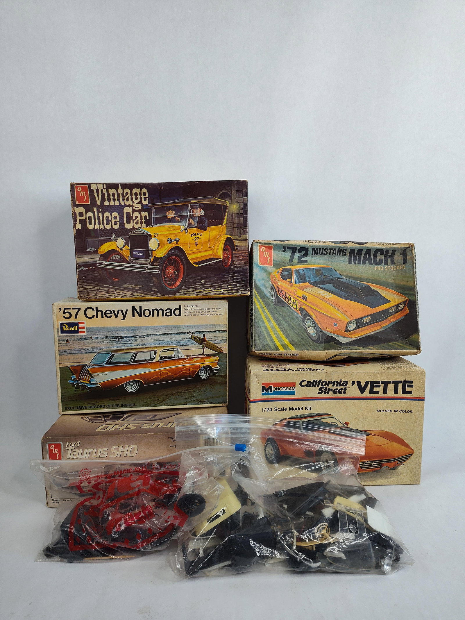 Great AMT Lot of Model Kits Inc. Ford Taurus, 57 Chevy Nomad, 72 Mach 1, Corvette & Police C (1 of 13)