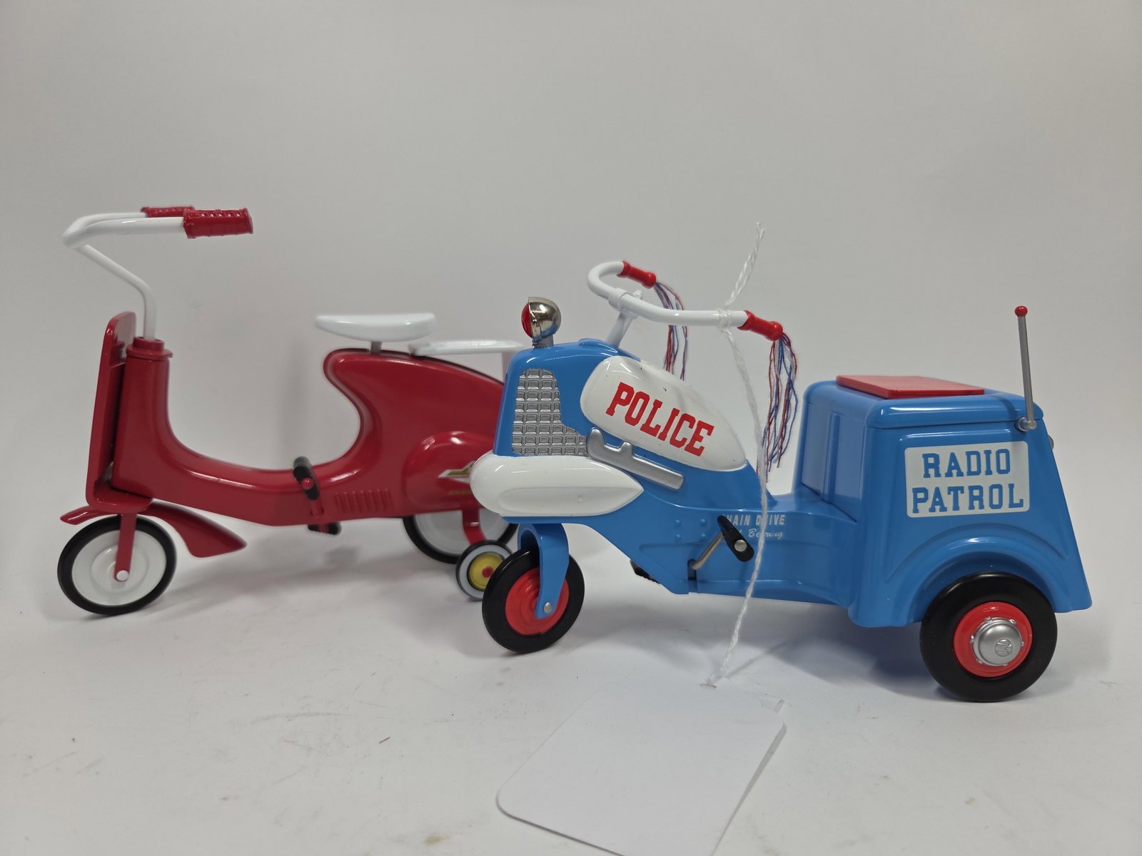 Kiddie Car Classic Miniature Tricycles: Murray 1958 Police Cycle and 1966 Super Sonda. Each is approx 5.5 inches