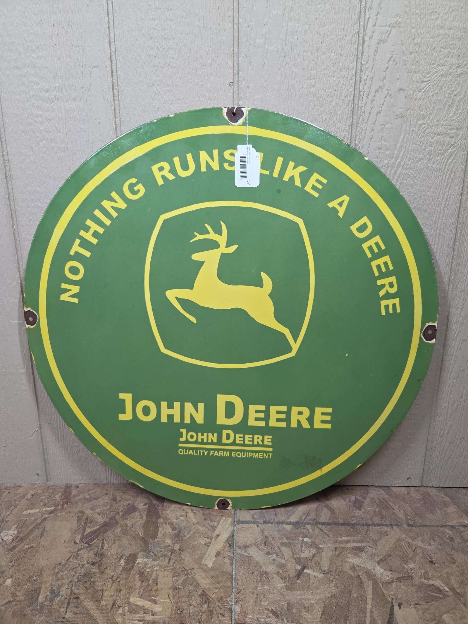 SSP John Deere Sign: Several hit show along mounting holes. Likely from the 80s, 30 inches round