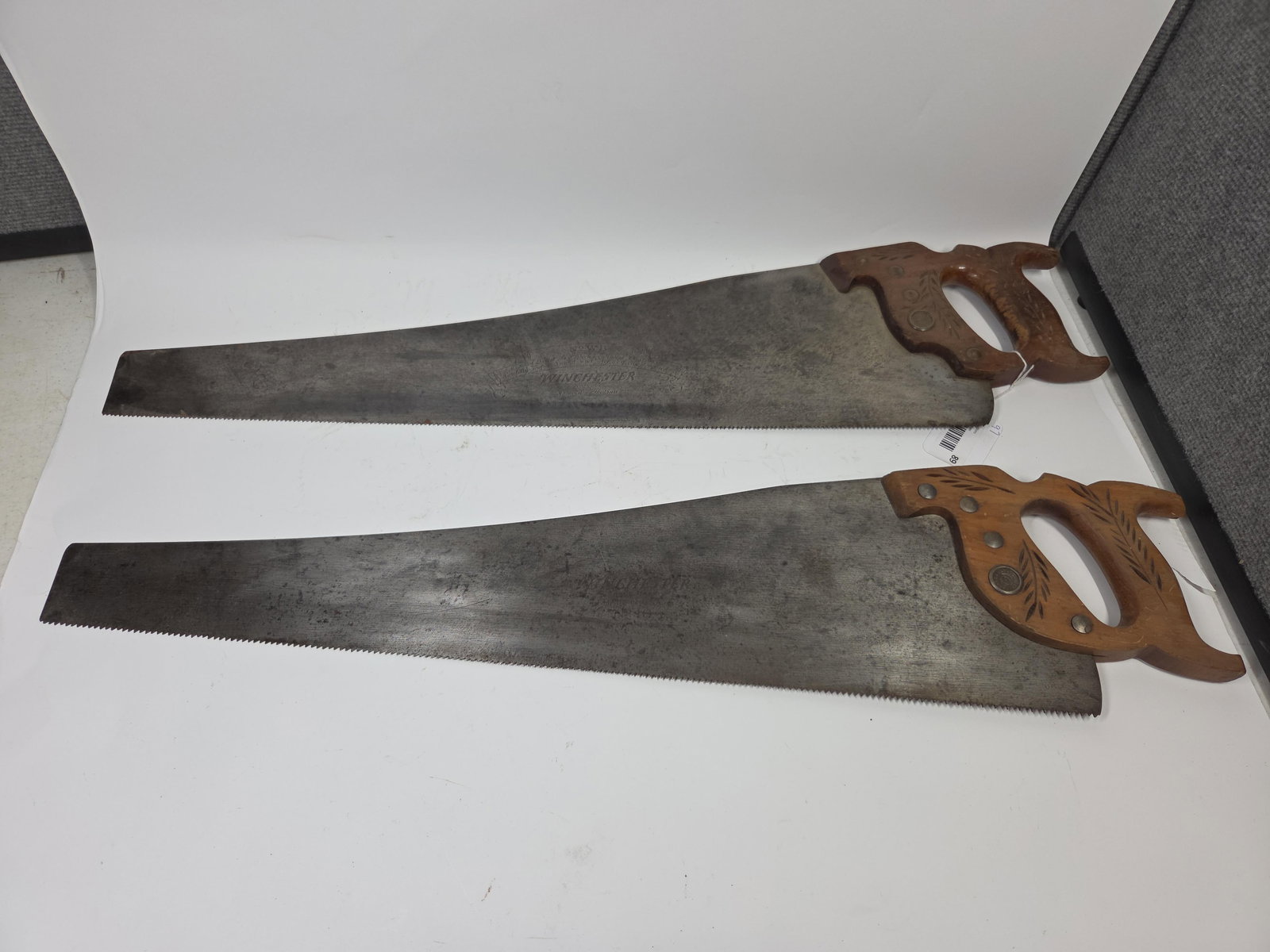 No 8 & No 10 Winchester Hand Saws: Both with wooden handles. 30 inches long. Logo to both blades