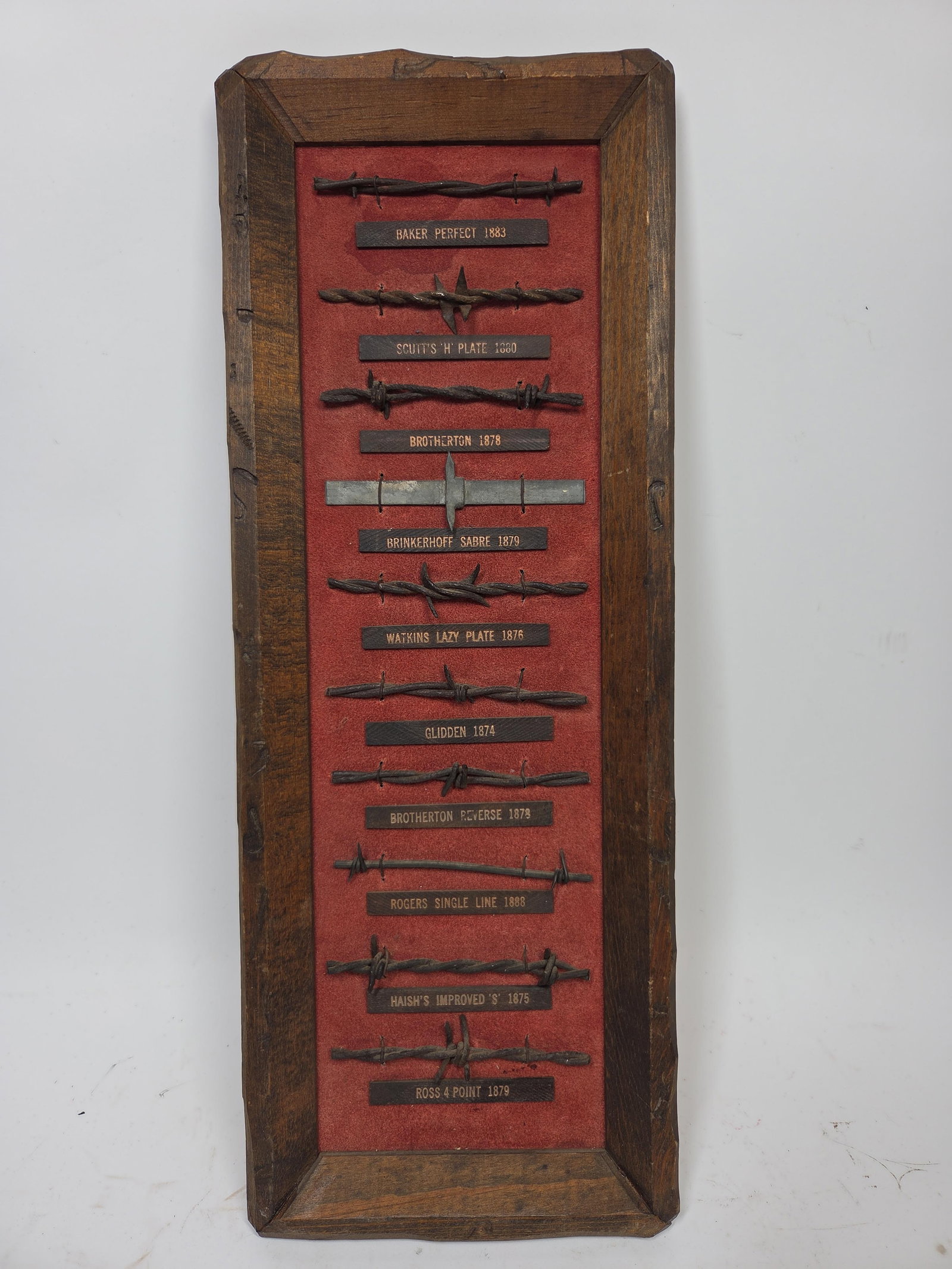 Antique Barb Wire Sample Store Display / Salesman Sampler in Wood Frame: Great early collector item showing 10 assorted styles as shown in photos in a 18.5 x 7 hand carved wood frame
