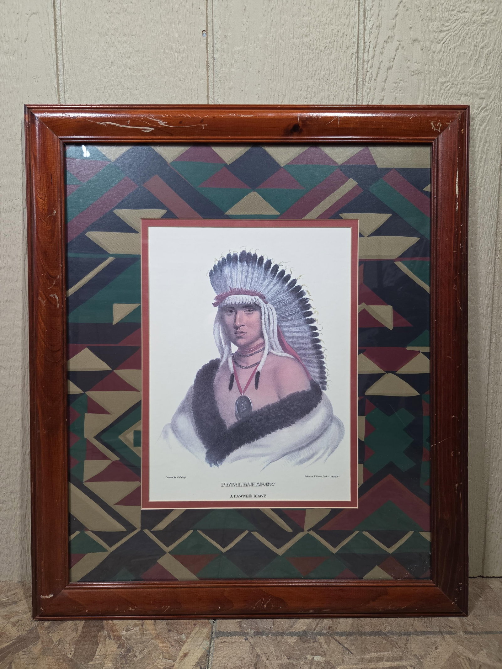 A Pawnee Brave CB King Lithograph: Framed and backed with a native design. 23.5x27.5