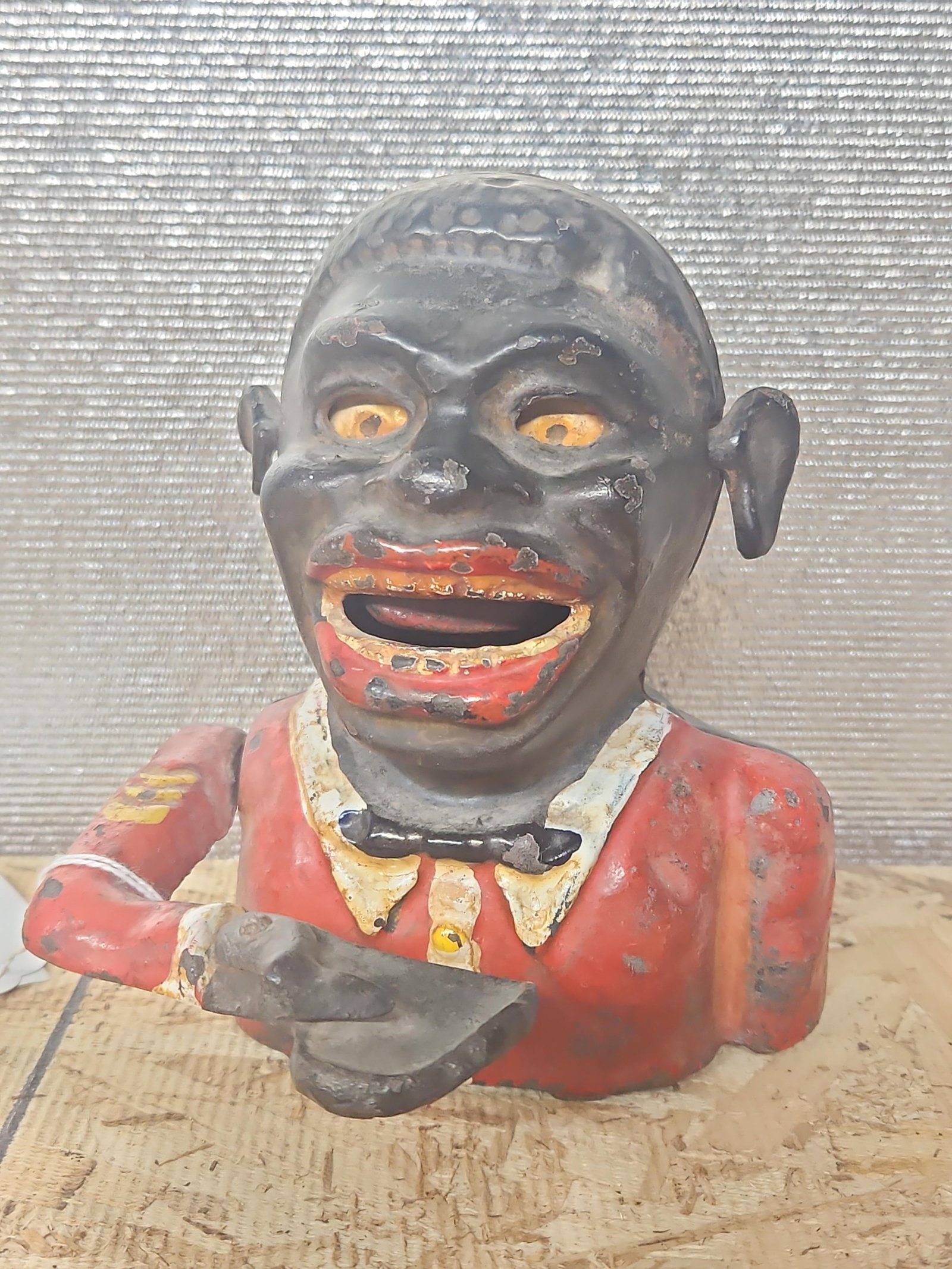 Jolly Man Cast Iron Bank: Eyes and ears move when arm is lifted. Some paint chipping throughout. 5x6