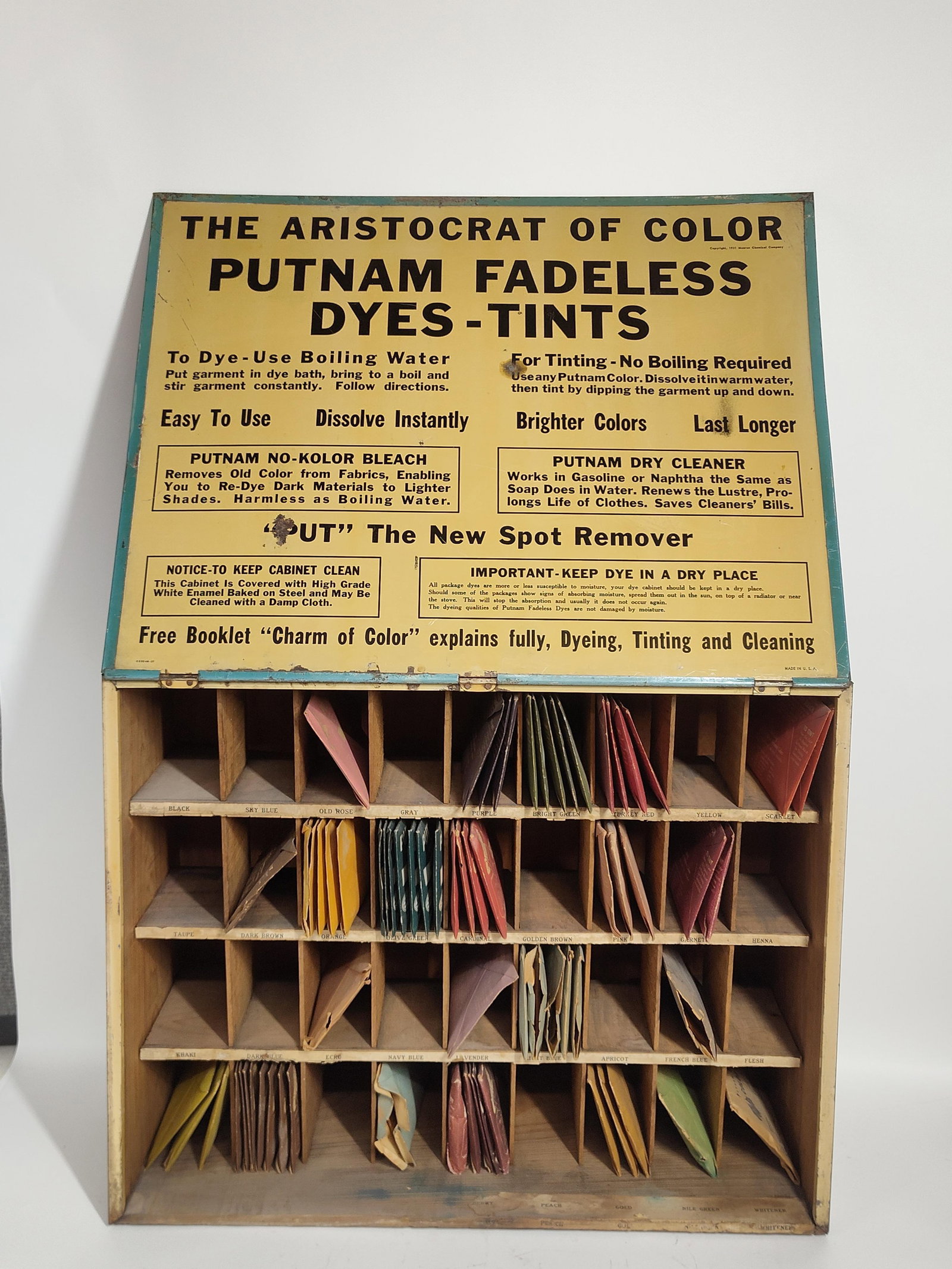 Putnam Dyes-Tints Cabinet: Graphics show to all 4 sides. Includes dye packs to interior sections. 19x7x15. Minor spotting and discoloring