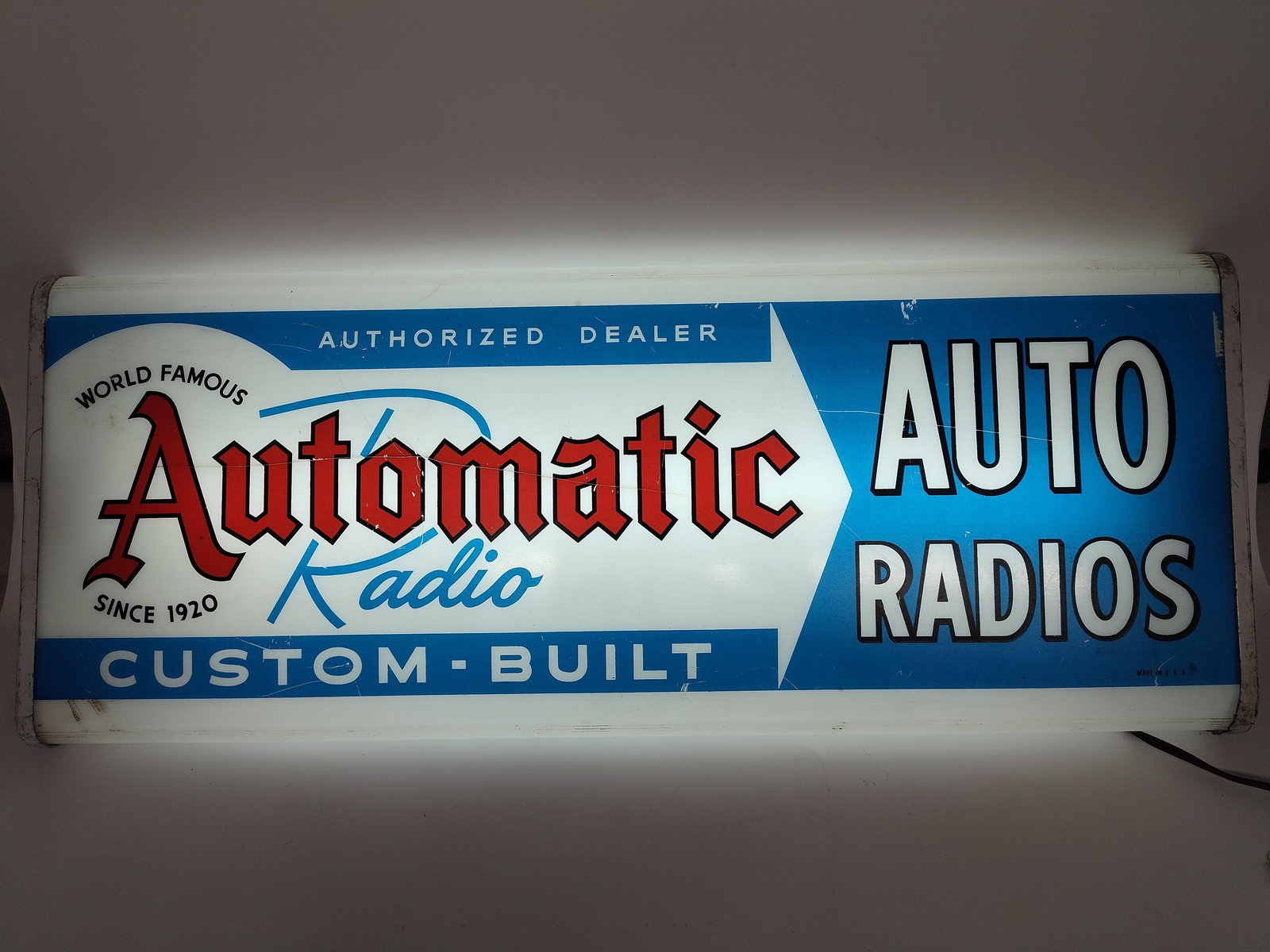 Automatic Radio Lighted Sign: Crack to plastic face. 26x10. Working condition