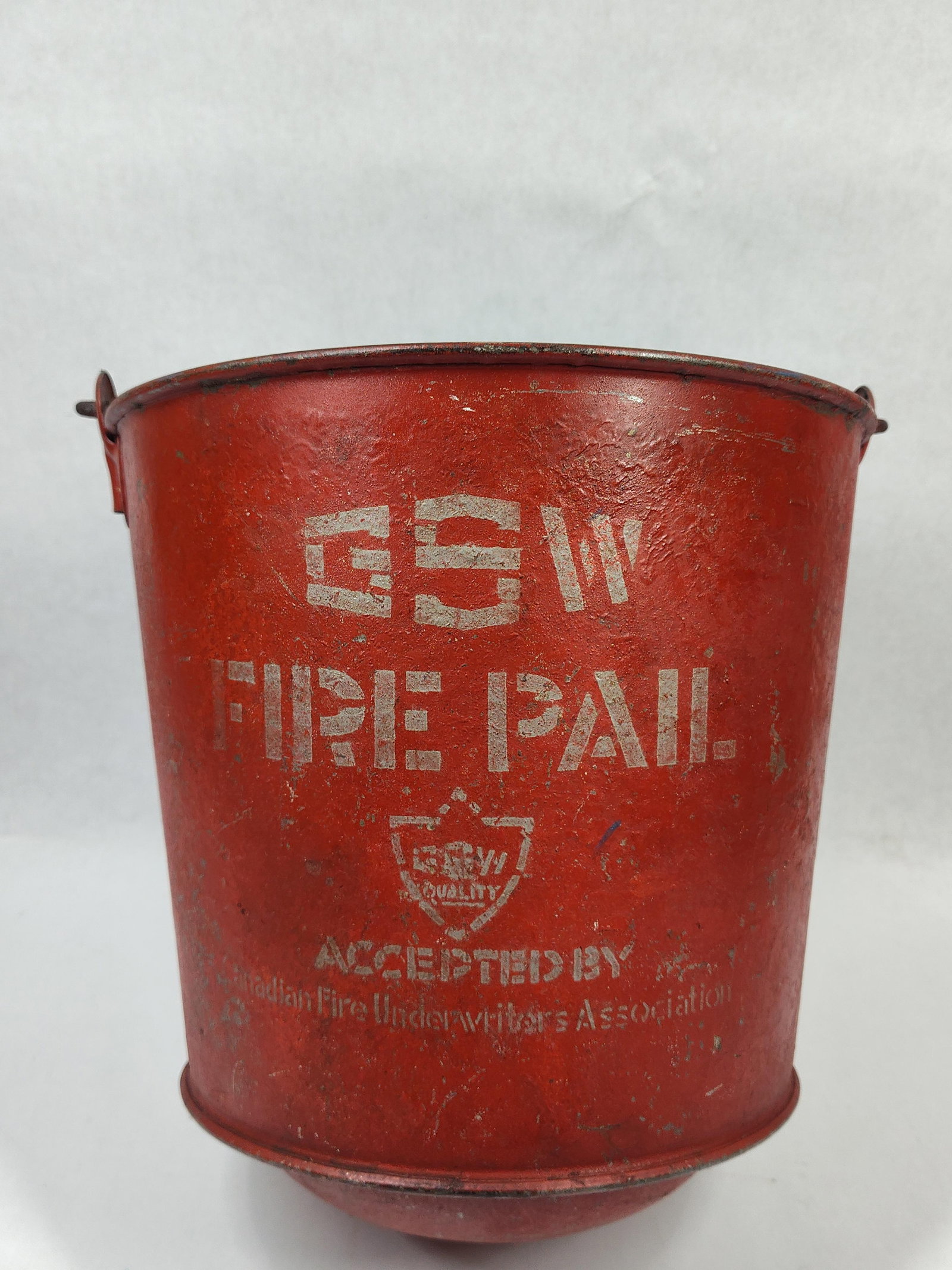 GSW Painted Red Fire Pail w/ Bale Handle: Showing areas of paint loss due to age and usage