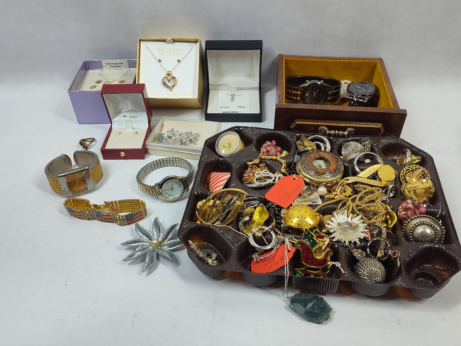 Sterling Silver w/ Genuine Diamond Necklaces, 14K Earrings, Watches, Rings, Necklaces, Bracelets and: This loaded lot of jewelry is a great assortment including NOS items and more this is unsorted as well as untested