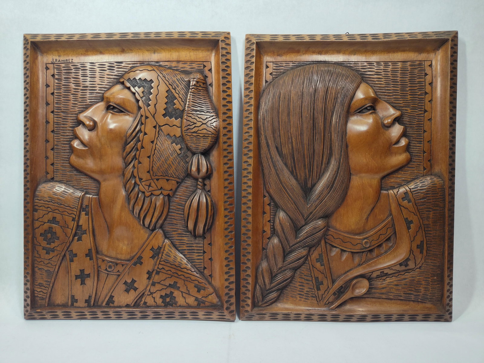 J Ramirez Hand Carved Mohogany Bolivian 1960's Relief Carvings Of Male and Female: Great hand carved plaques artist signed measuring 125 x 17