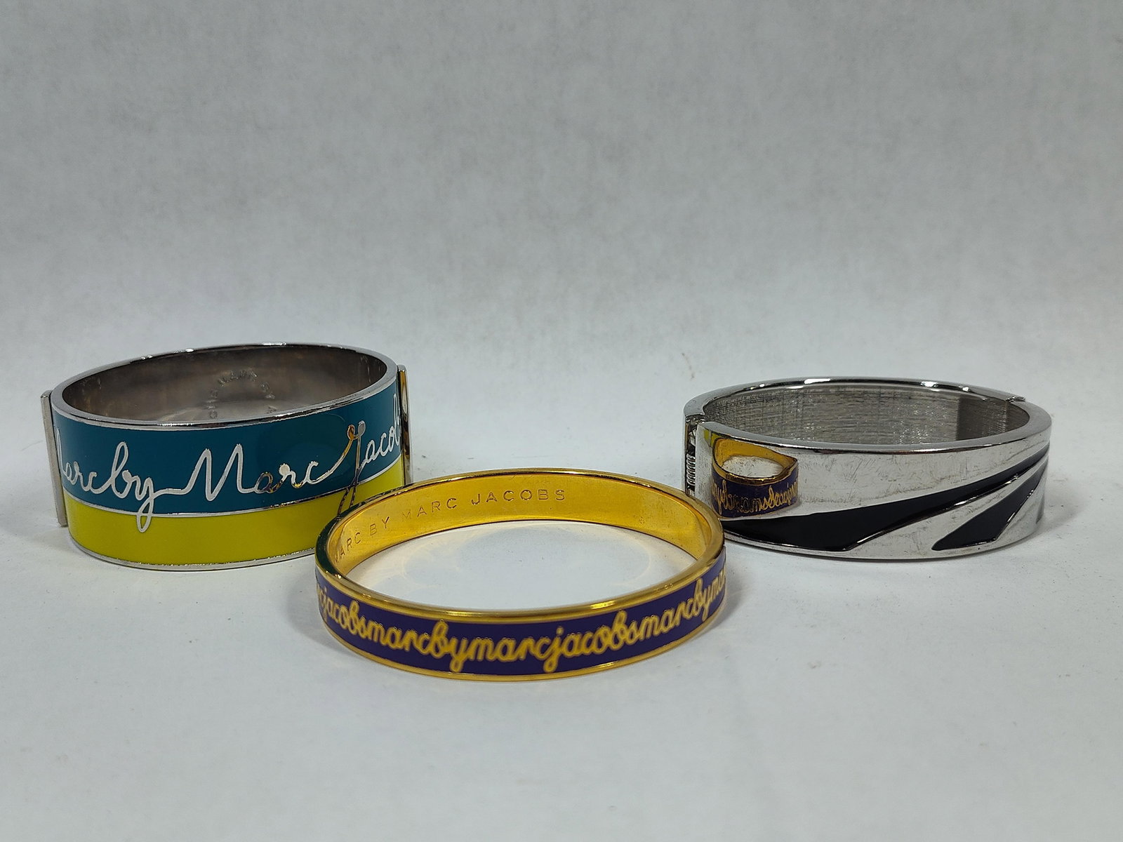 Designer Marc Jacobs Enamel Cuff Bracelets and Silver Clamper Cuff w/ Black Resin Inlay In a Geometr: Great collectible bracelet lot of 3 being in like new condition