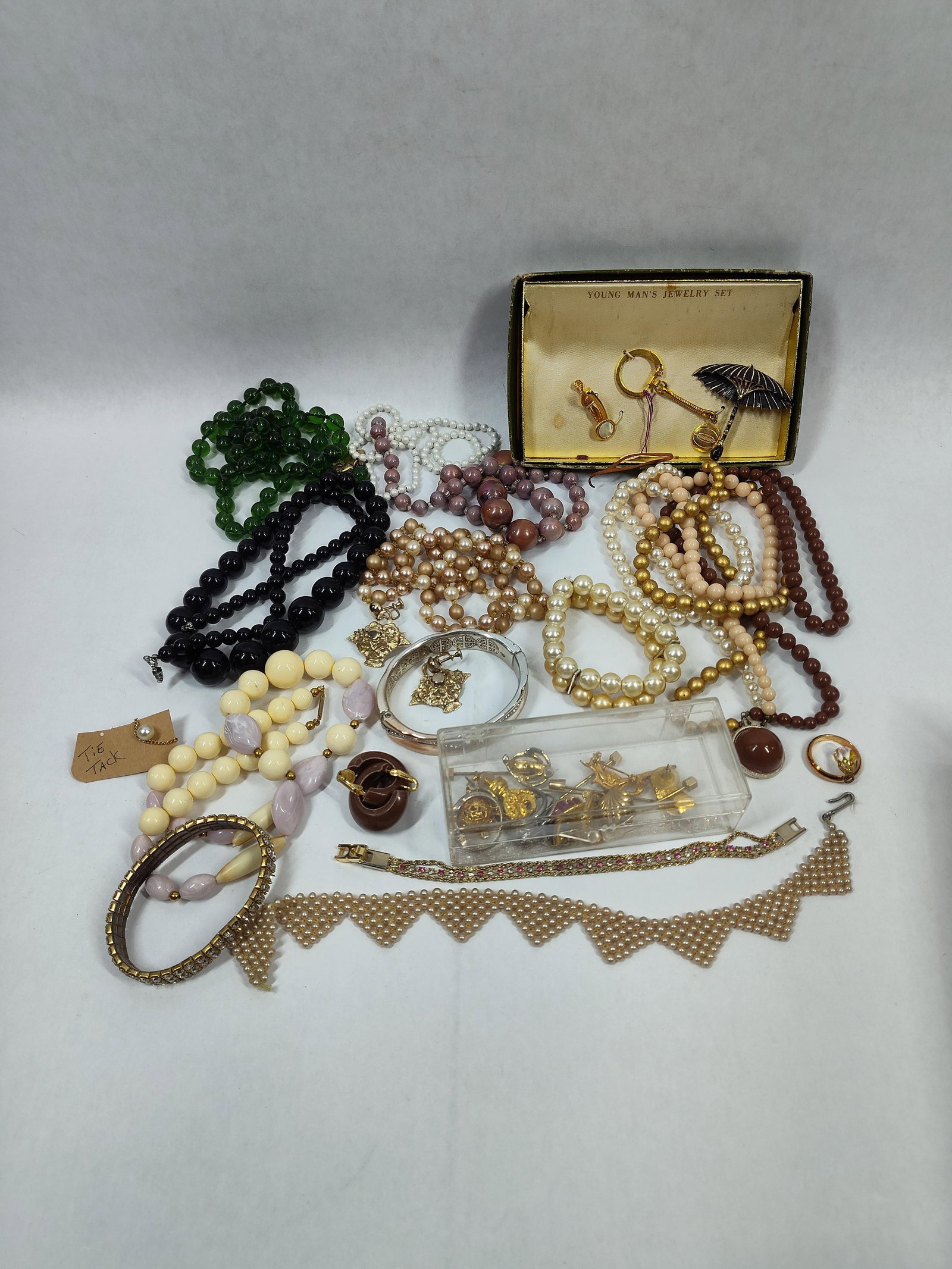 Art Deco Green Glass, Pearls, Lucite, Tie Bars, Tacks, Rhinestones and More: This great jewelry lot is unsorted and untested including many great items appearing most all to be vintage