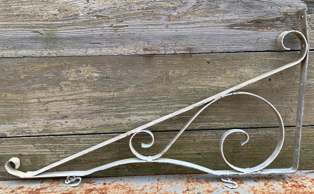Antique Wrought Iron Storefront, Gas Station, General Store Scroll Sign Bracket with Hooks: 30 IN width x 17 IN plus 2 1/2 IN loop/hooks, old white paint over the metal, some minor distortion to the metal bracket from age and use, hefty in weight and structurally sound.
