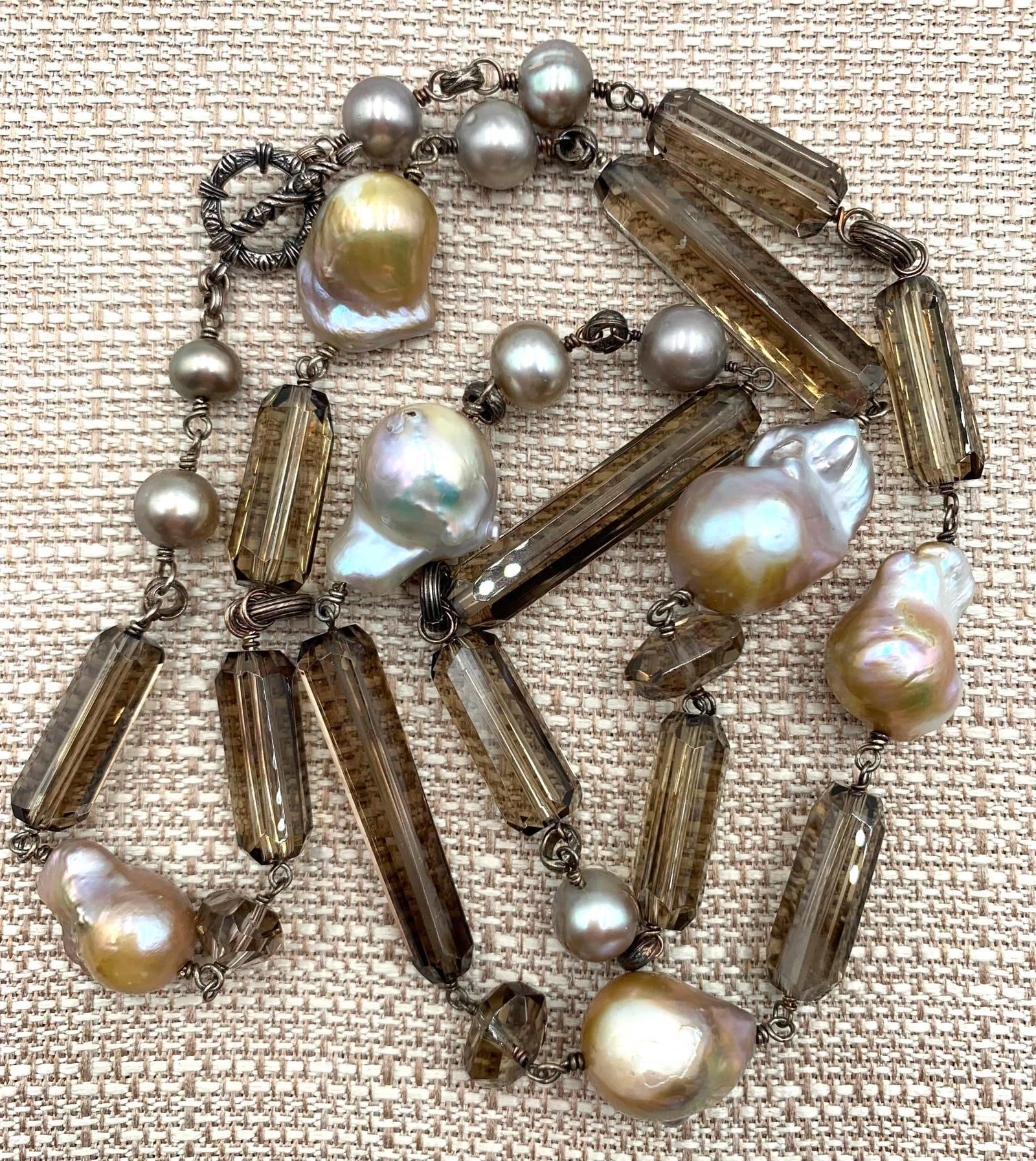 Glorious STEPHEN DWECK Champagne Baroque Freshwater Pearls, Faceted Smoky Quartz, Station Necklace: SUPERB! 32 IN length, Sterling silver ornately embossed toggle clasp, HUGE 27mm to 20mm baroque freshwater pearls, gleaming 8-10mm champagne freshwater pearls, 42-11mm faceted burnished smoky quartz w
