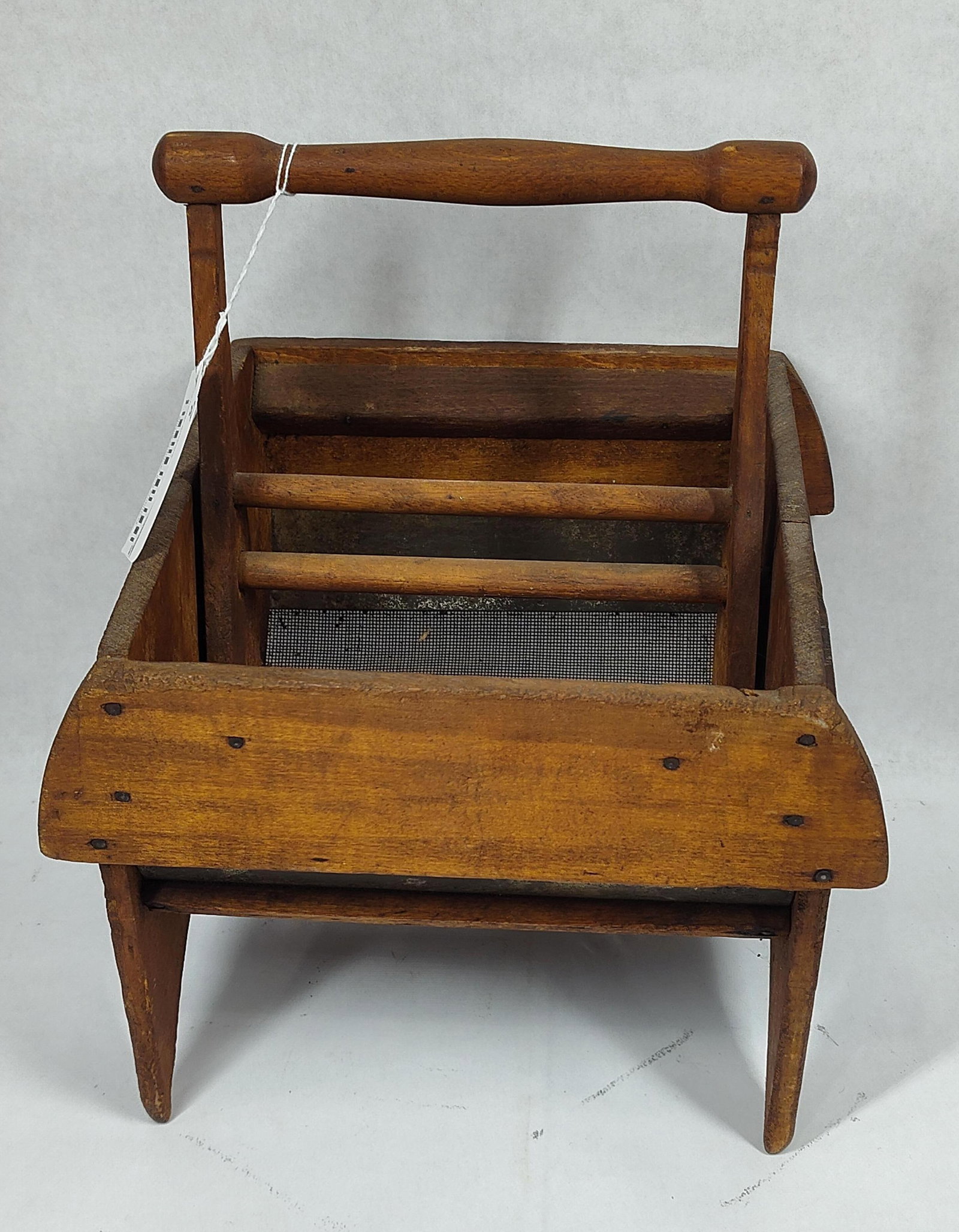 Primitive Table Top Sifter: With faintly visible stenciled graphics on one side. 10.5in x 9.25in 13in tall to top of handle.
