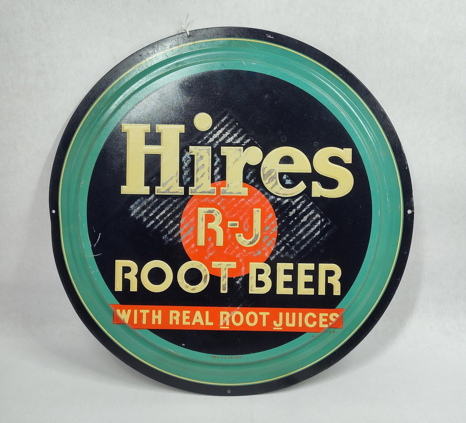 SST Hires Root Beer sign: 1-sided painted metal sign with cardboard marks in center. 14in diameter.