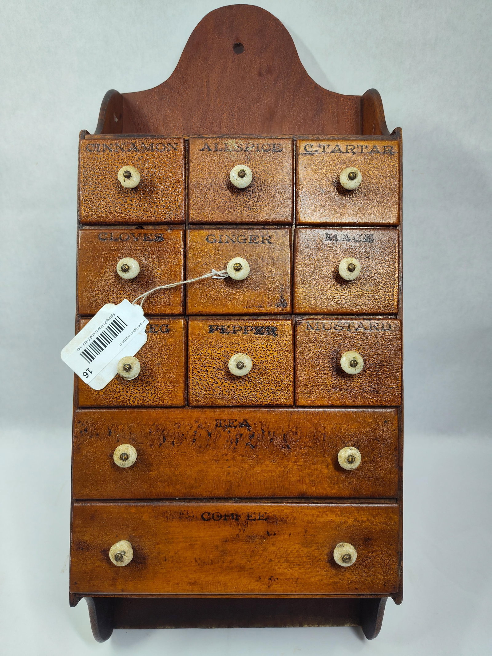 Early American 11-drw Hanging Spice Cabinet: With great original alligator skin surface!! All drawers with scripts and original porcelain pulls. 10in wide 4.5in deep 24.75in long.