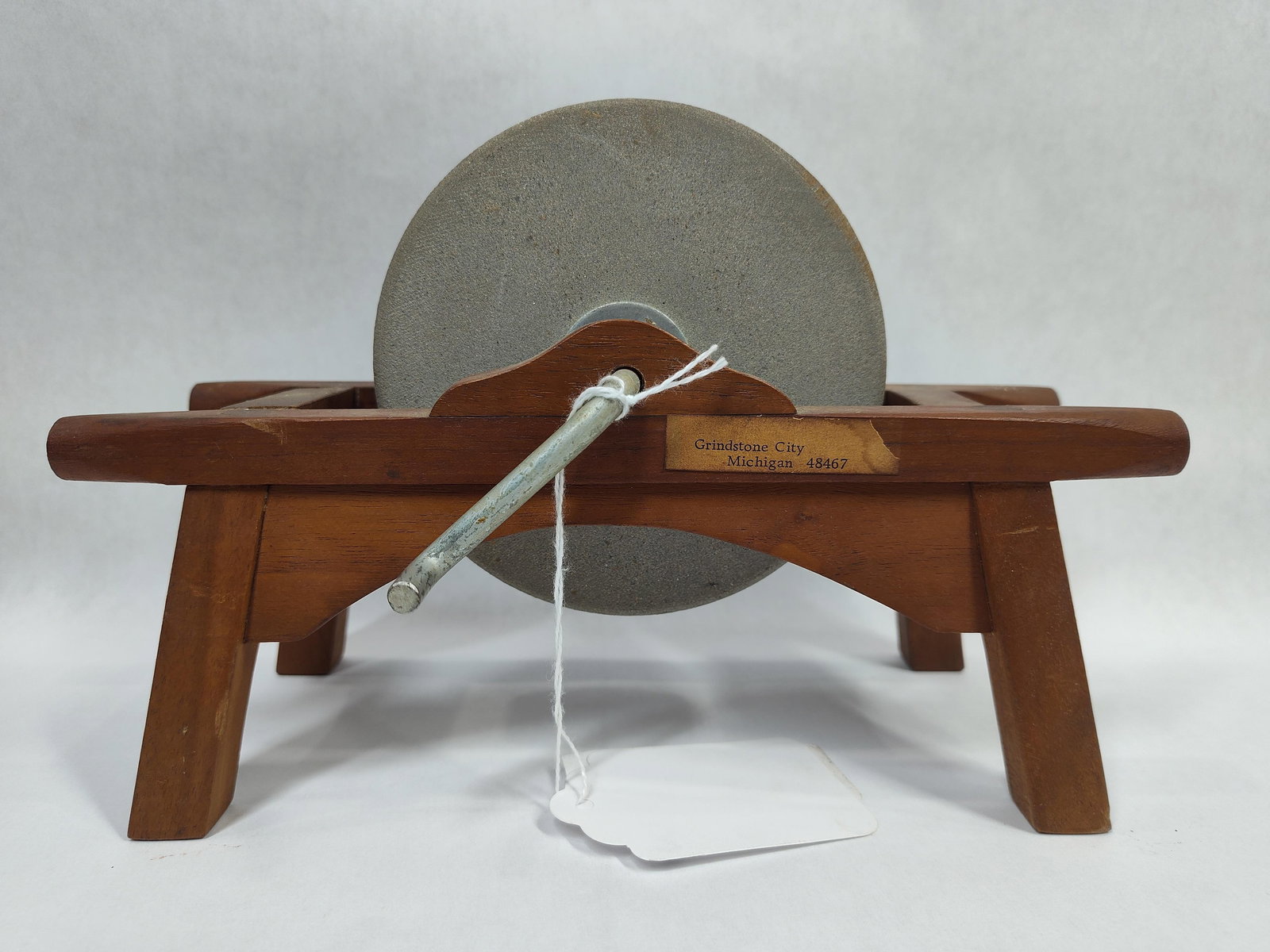 Neat Minature Grinding Stone: Frame has separated at glue joints on each end. Stone 4.75in diameter overall is 9.25in long 6.25in tall.