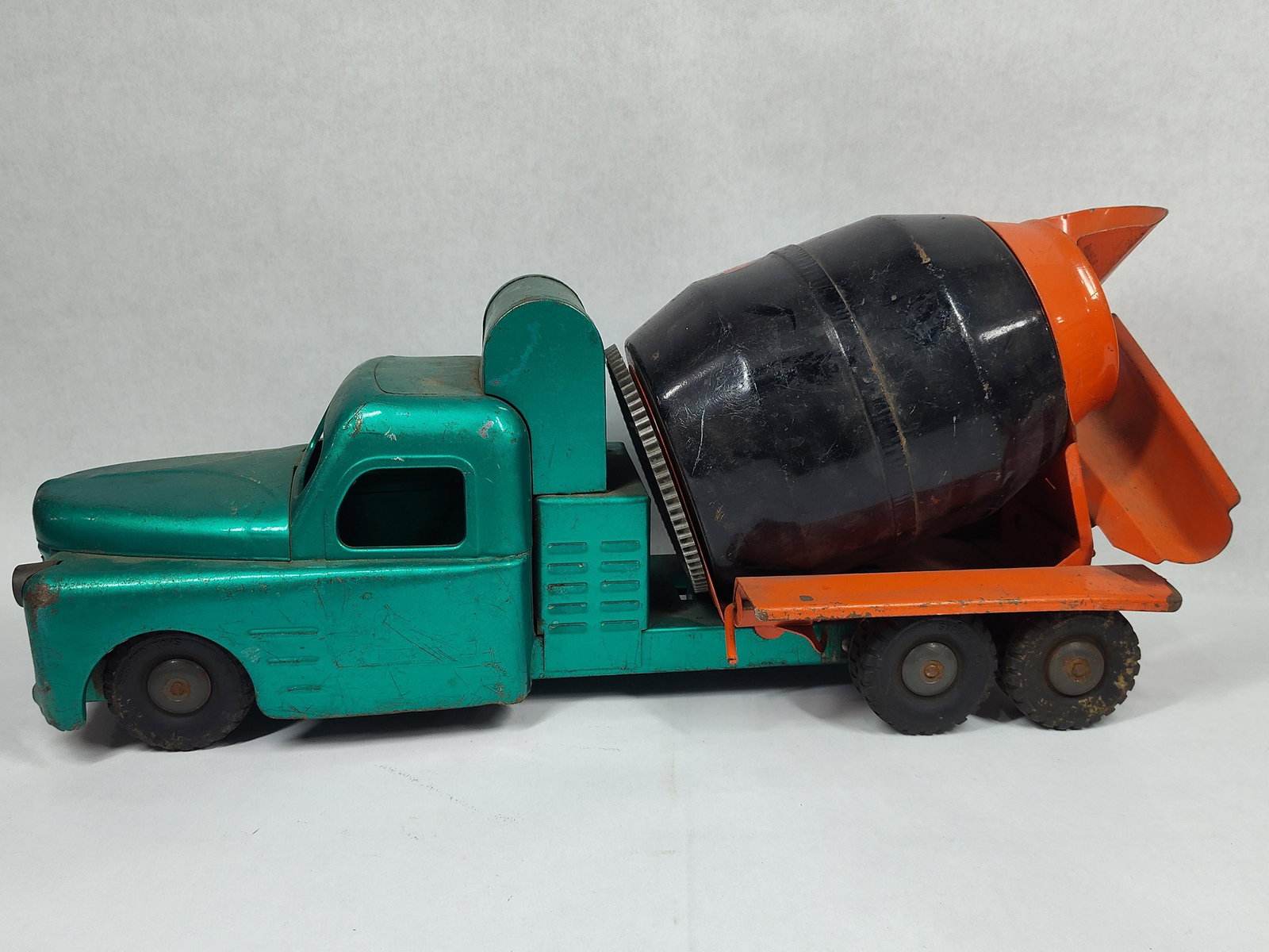 1950s Structo Ready-Mix Concrete Truck: Shows some paint wear and covered in storage dust but overall in good solid condition! 21in long.