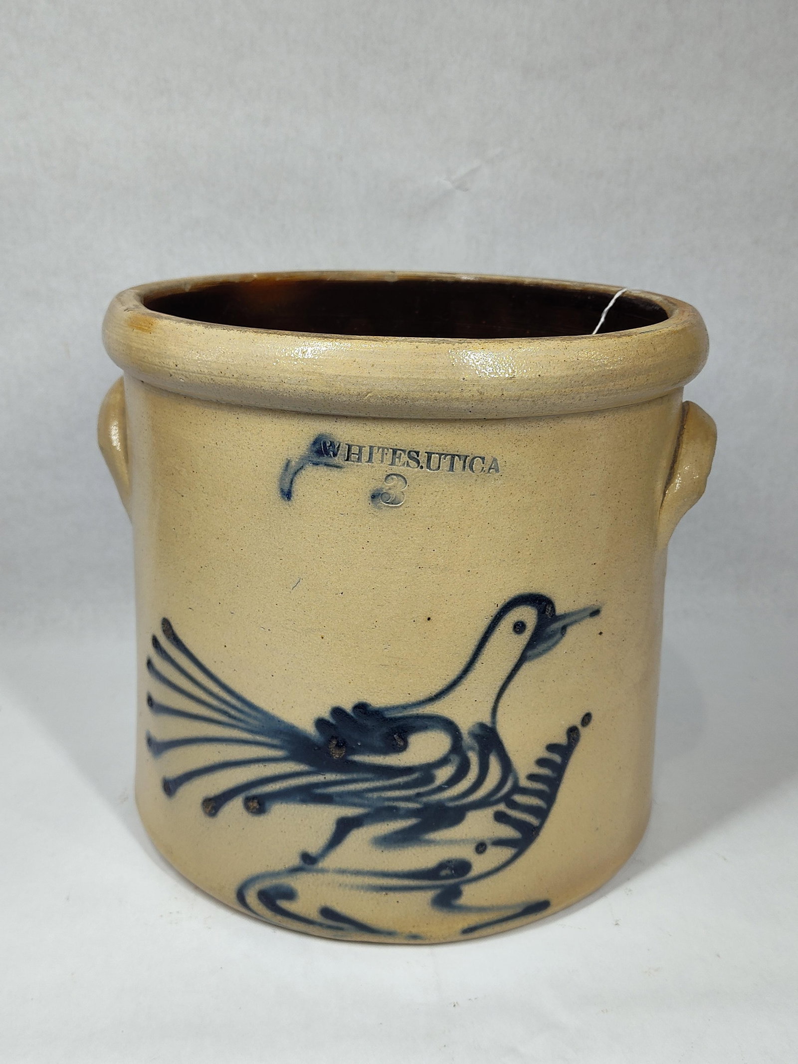 Whites Utica Bird design crock: With a small flake on rim and a crack to interior bottom but not visible from outside. Overall is nice and clean! 11in diameter 10.5in tall.