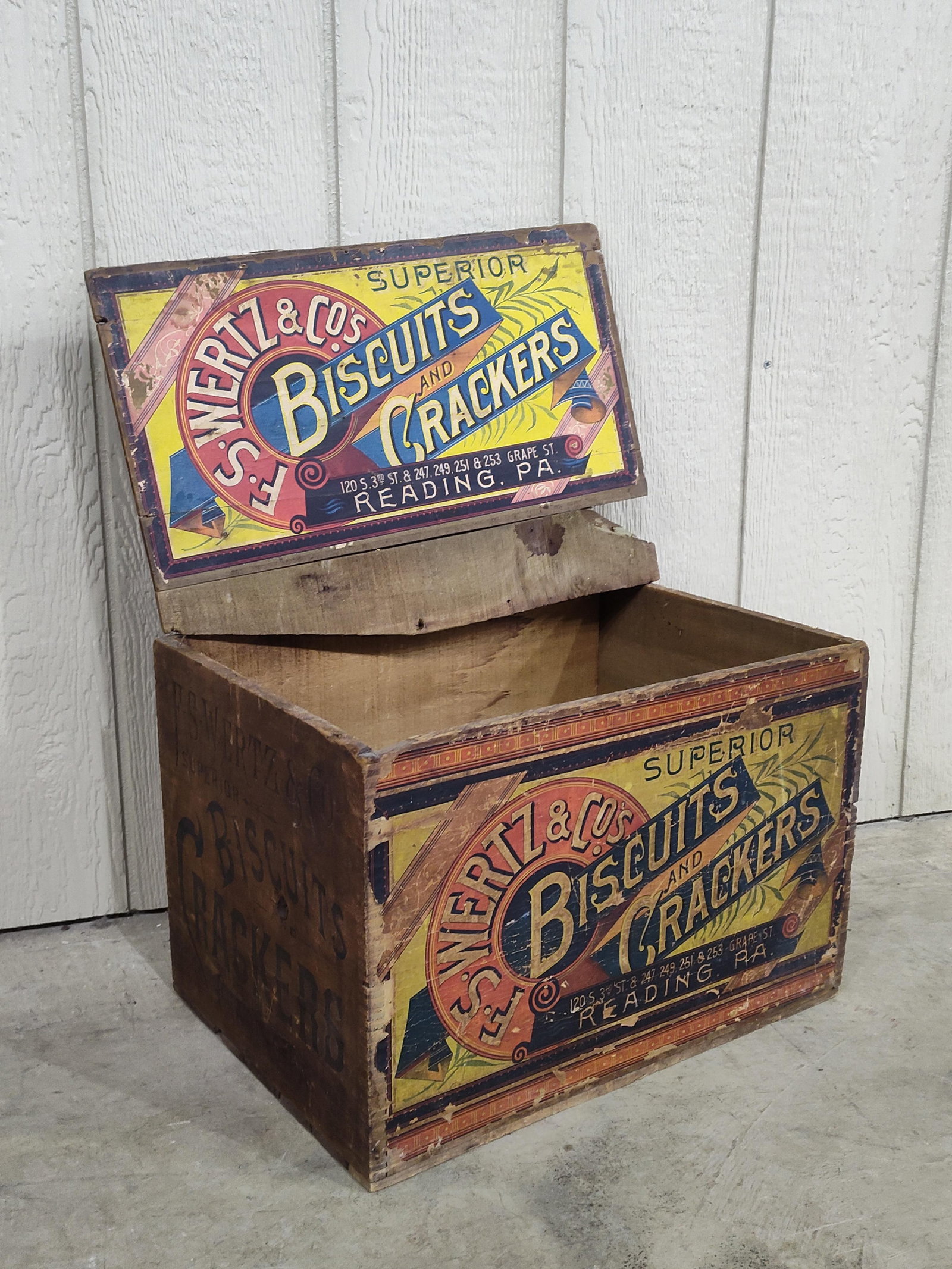 F.S.Wertz & Co's Biscuits and Crackers dovetailed box: With hinged lid and has small break on each end of top. Nice graphics on left side and original label on front! 12.5in wide 18in long 12in tall.