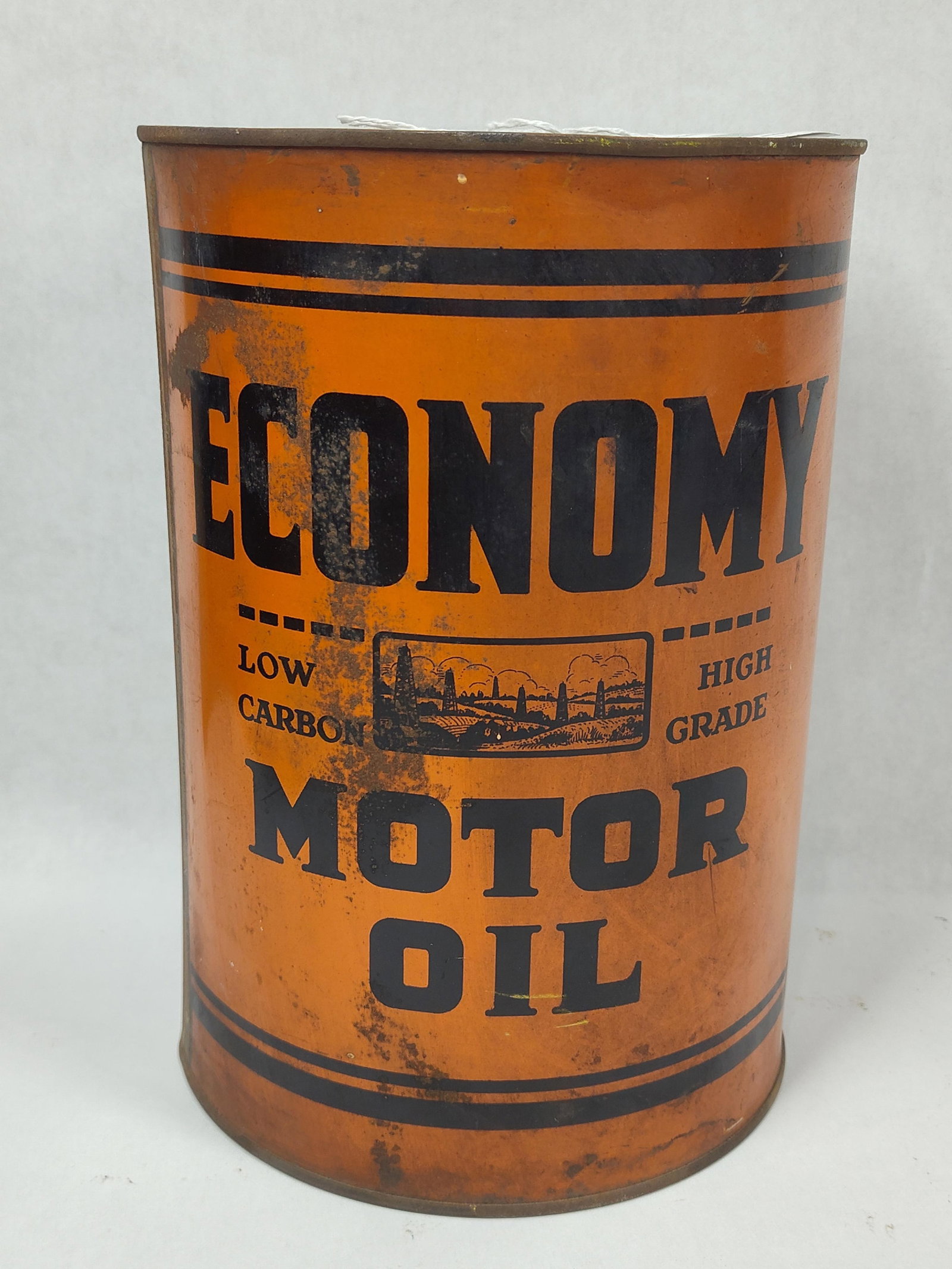 Economy Motor Oil 5qt can: Empty can with a few minor dents and scratches, no punctures. Will display excellent!! 9.5in tall.
