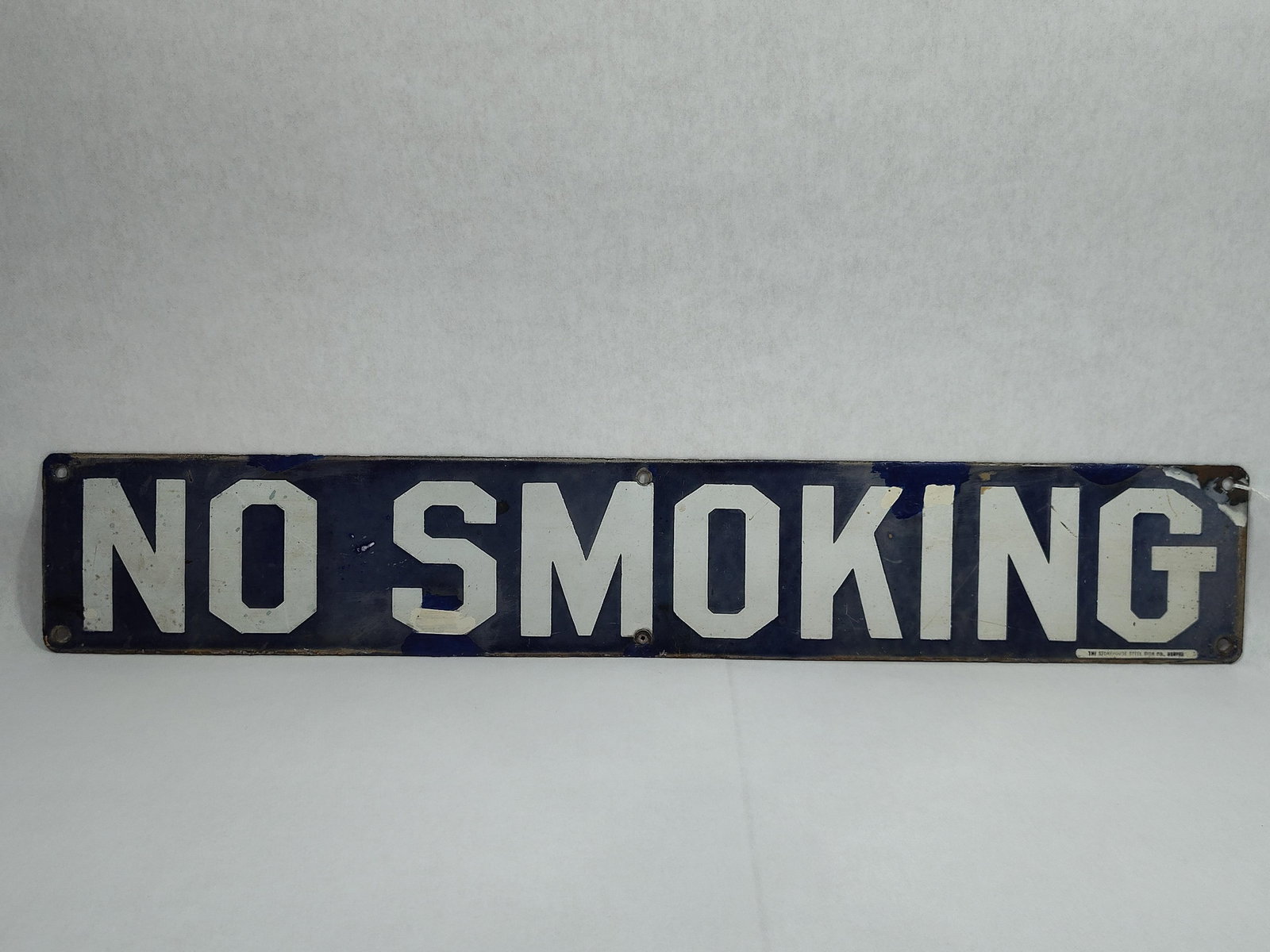 SSP No Smoking sign: 1-sided porcelain sign with fading or hazing in blue, darker blue spots are touch-ups. 4in x 24in.